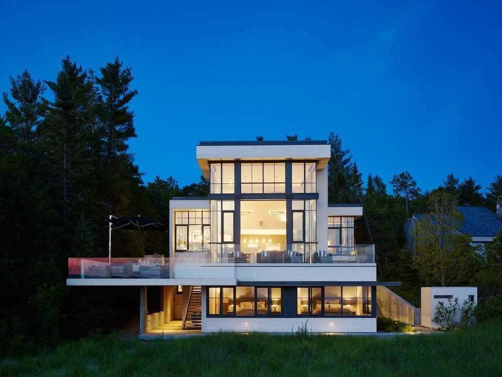 Rear exterior of modern home at dusk