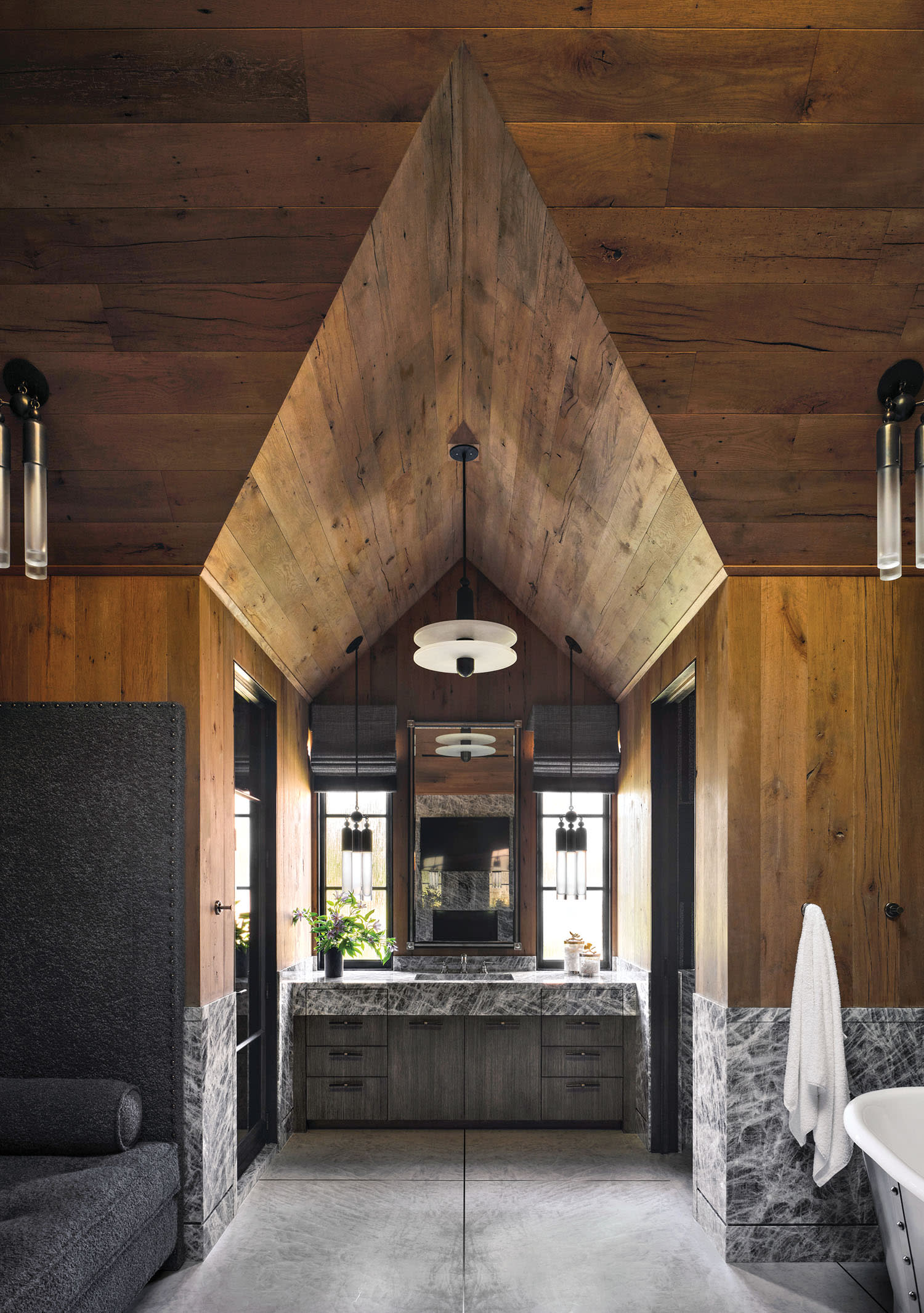 bathroom with reclaimed-oak-paneled walls and dark gray furnishings