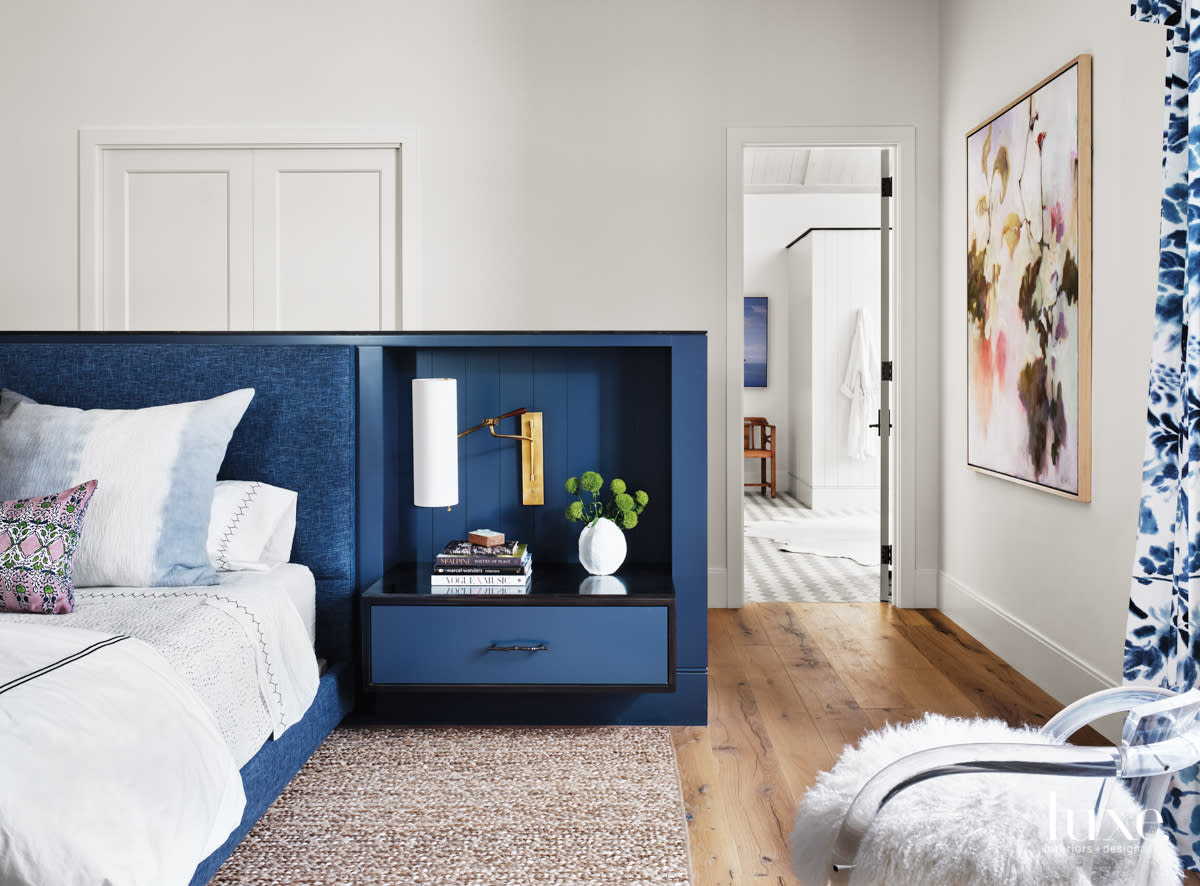 Master bedroom with a custom wood bed done in soven indigo fabric
