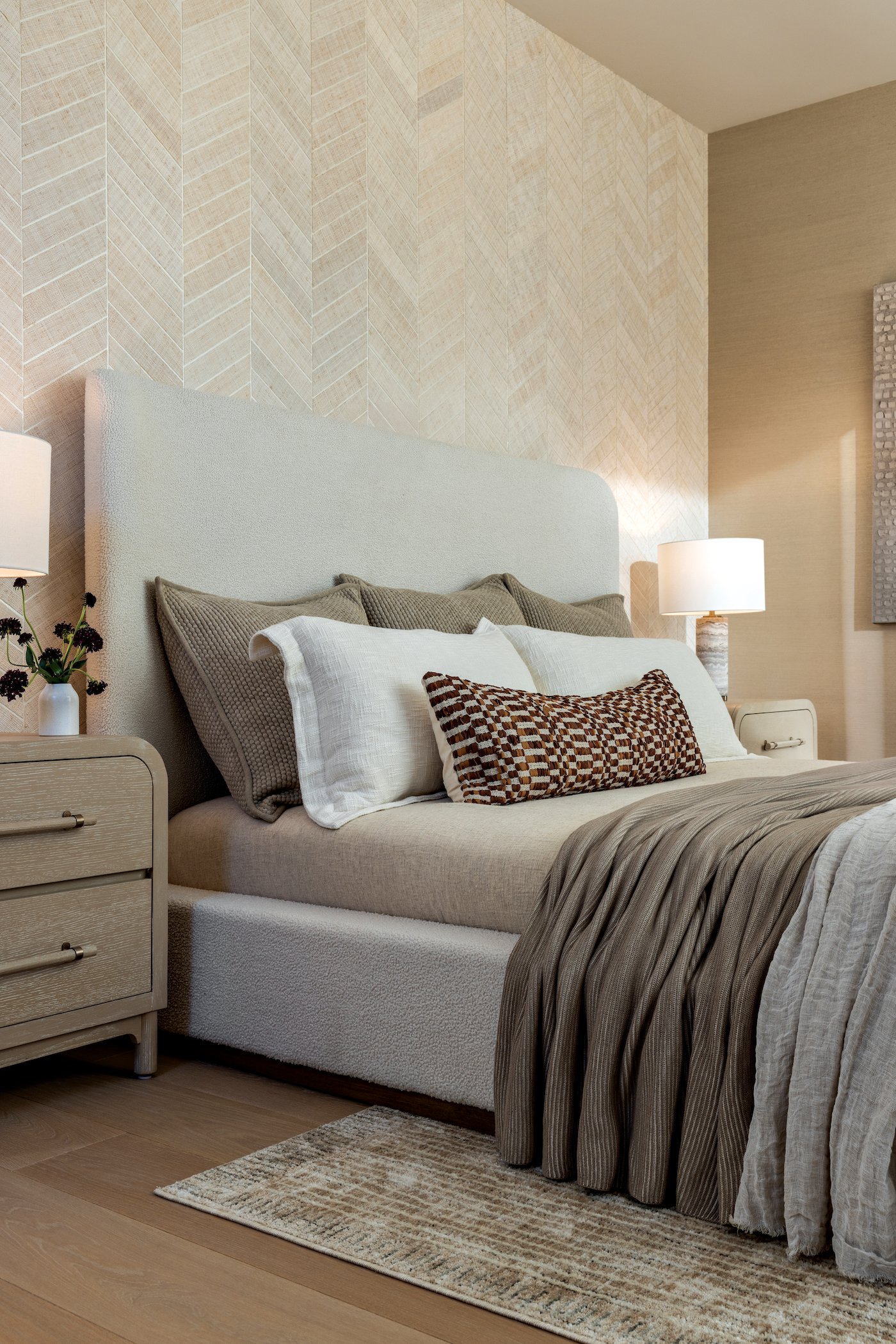 Primary bedroom featuring high-end linens and curated artwork creating a serene retreat.