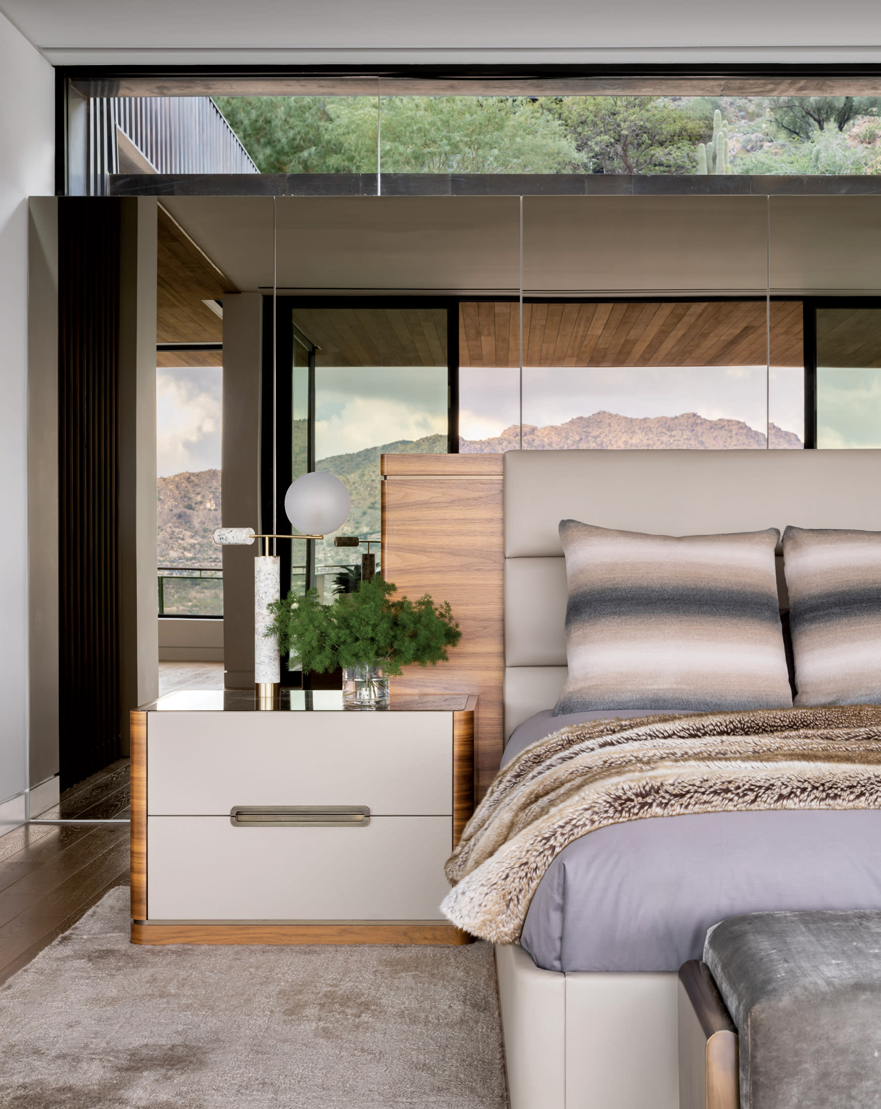 warm and contemporary bedroom with layered textures and reflections of the Arizona mountains