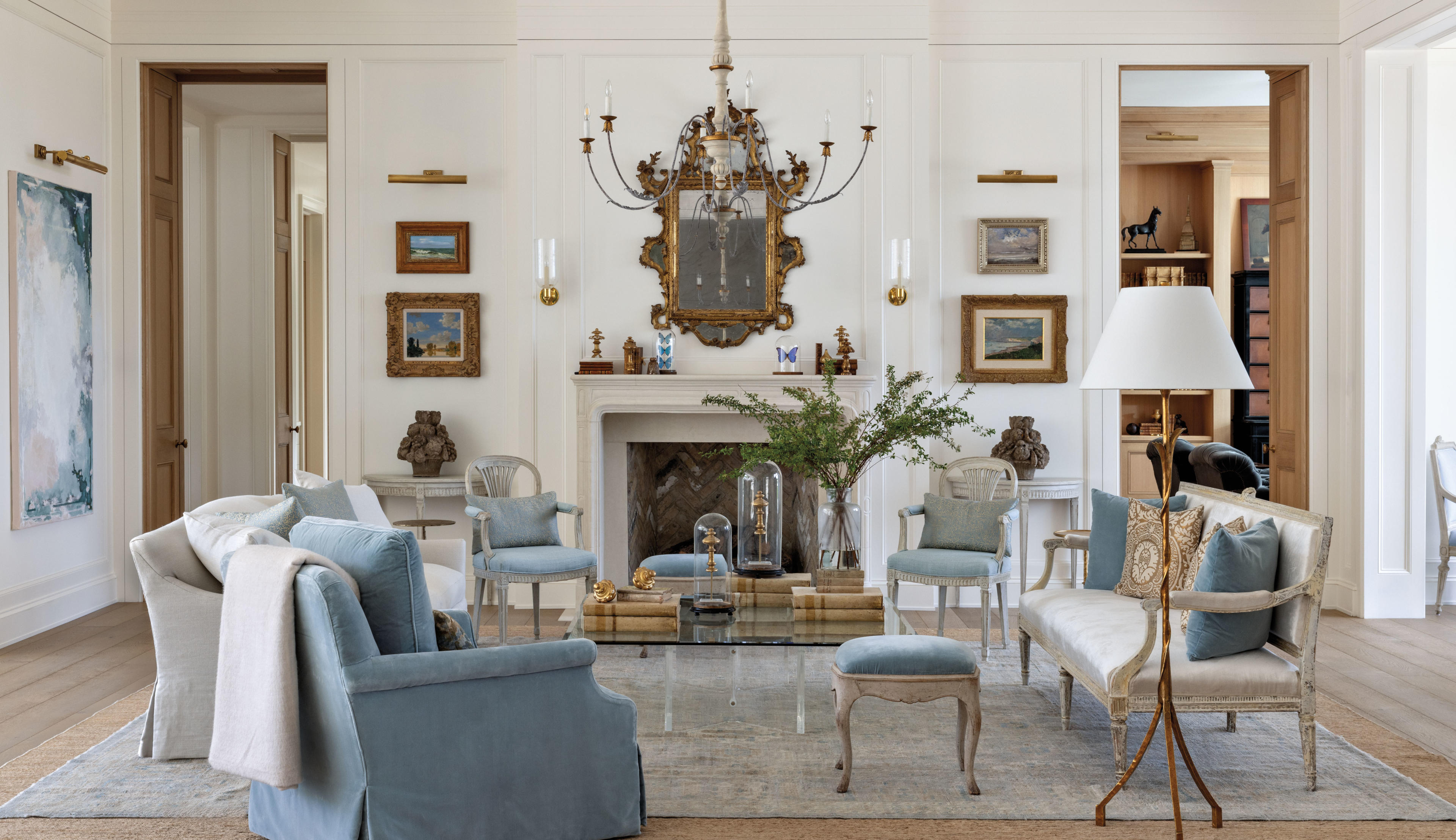 elegant living room with vintage accents and pops of blue