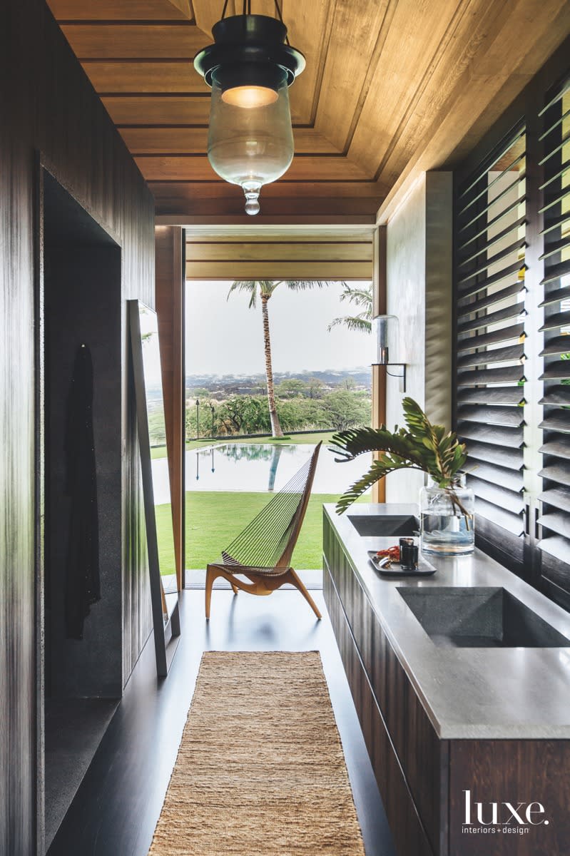 In this Hawaiian bathroom sanctuary, designer Nicole Hollis brought in color, textures and surfaces from the outside, giving the space a deep connection to the land.