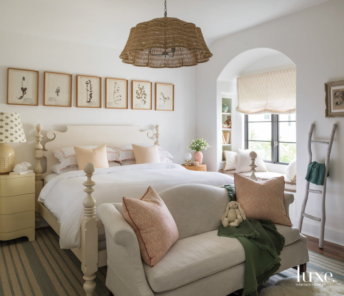 bedroom with prairie inspired elements, a banquette sitting area and chandelier