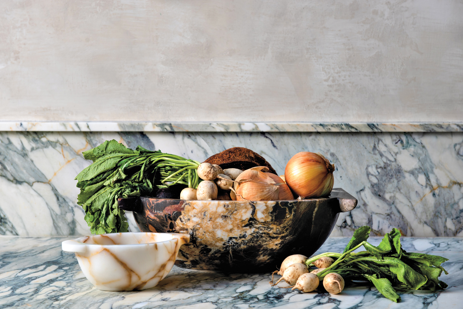 Two artisan-crafted bowls filled with vegetables