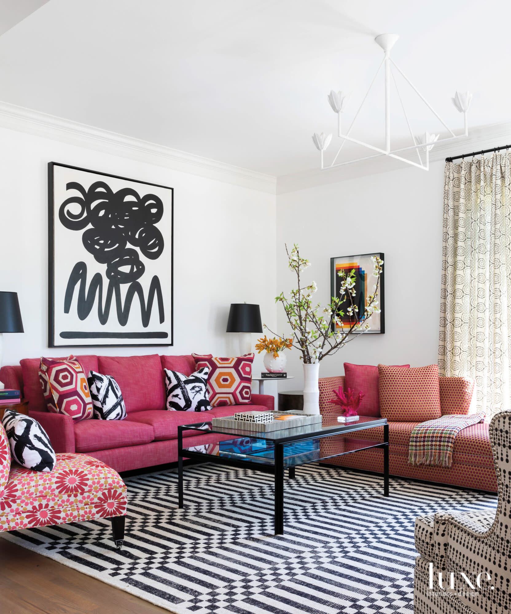 Sitting room with pink furnishings and vivid patterns