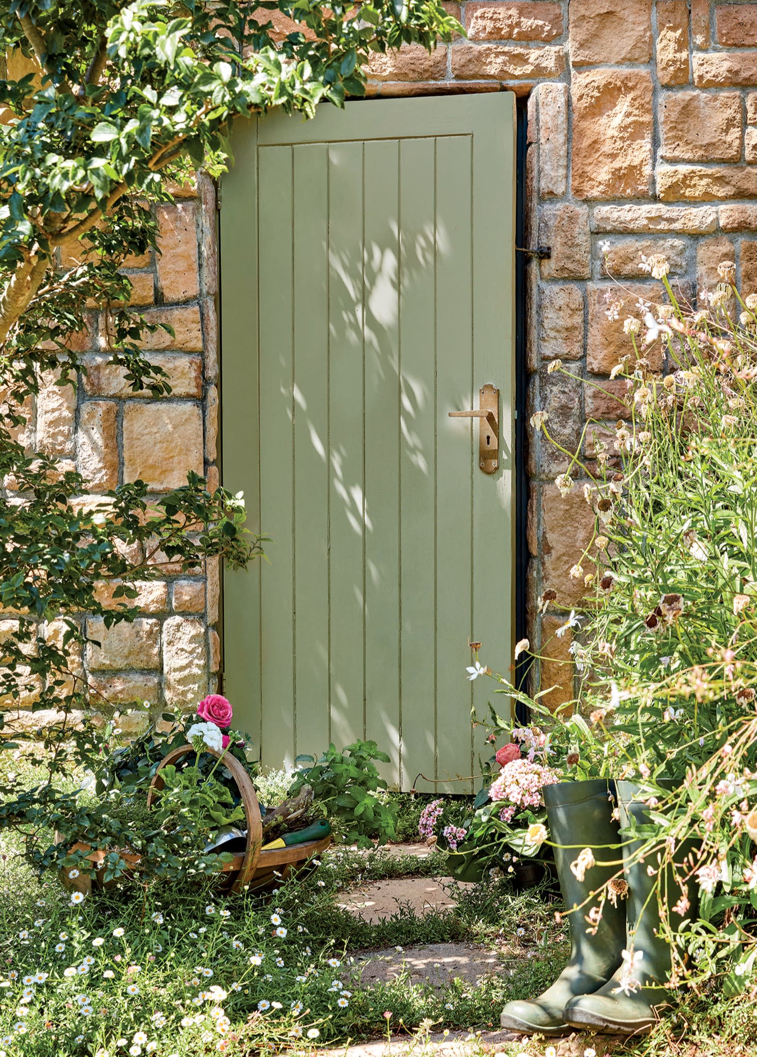 green door on a stone cottage exterior