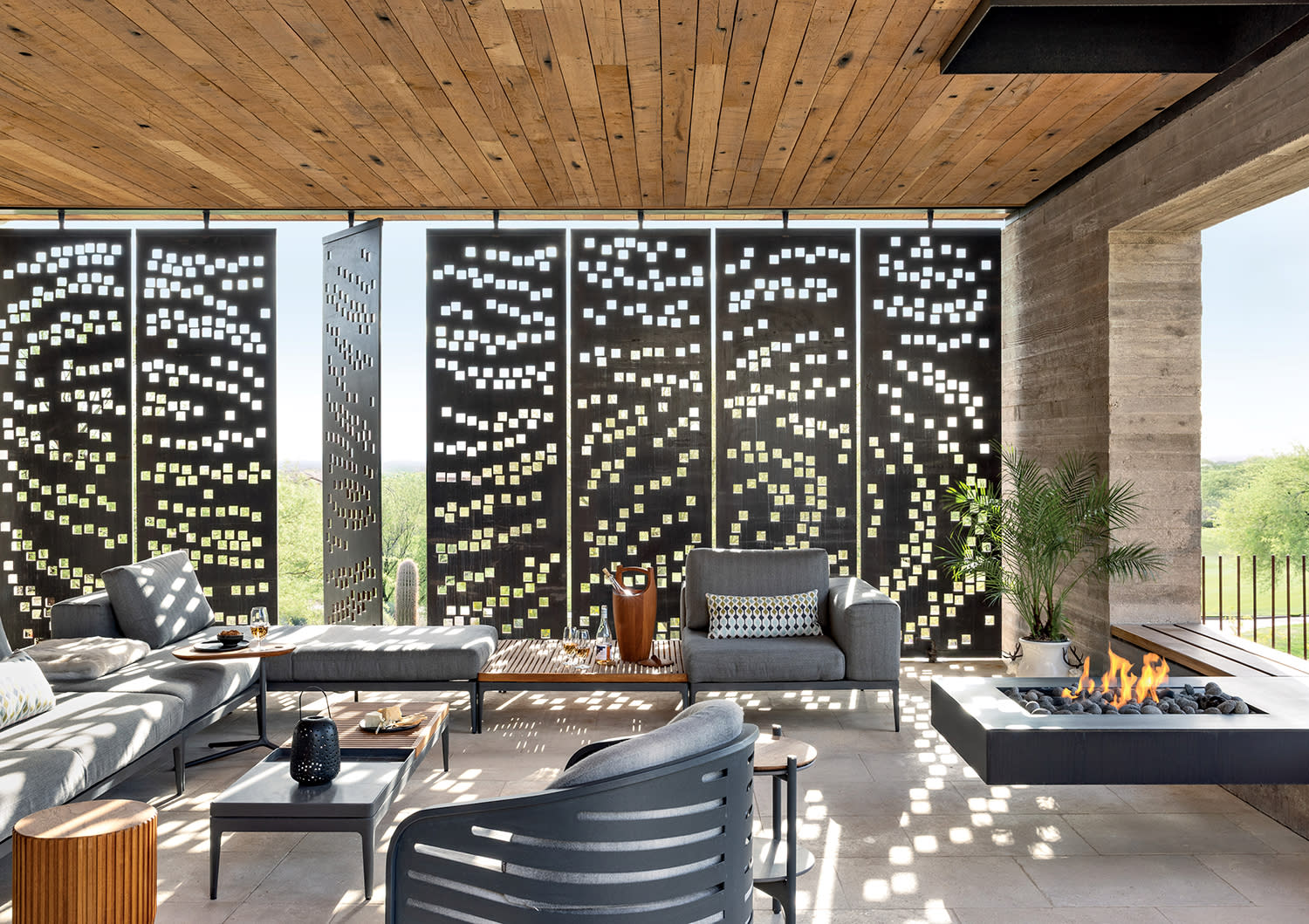 loggia with reclaimed wood plank ceiling and a steel panel structure