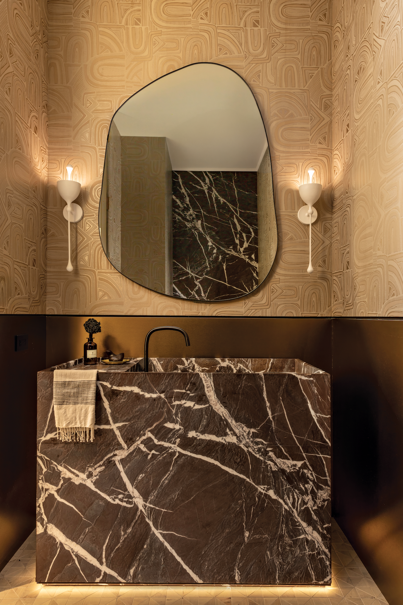 Bathrooms and closets featuring high-end marble surfaces and custom stone installations.