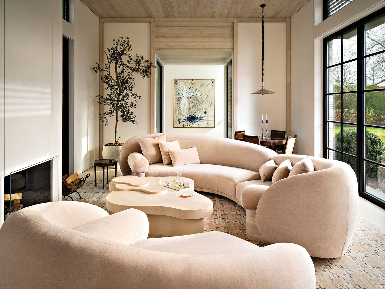contemporary neutral living room with a pale pink mohair sofa