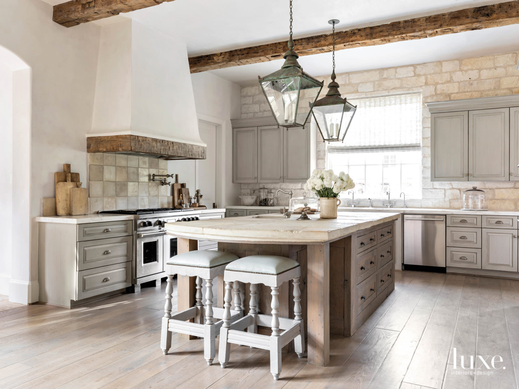 Neutral kitchen with texture and architectural elements.