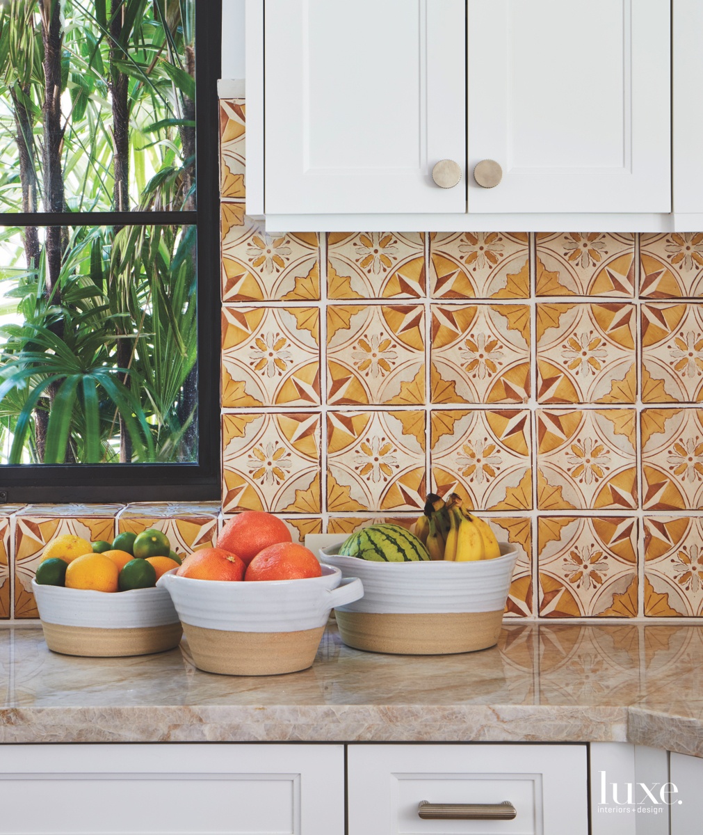 eclectic kitchen marble countertops white cabinetry