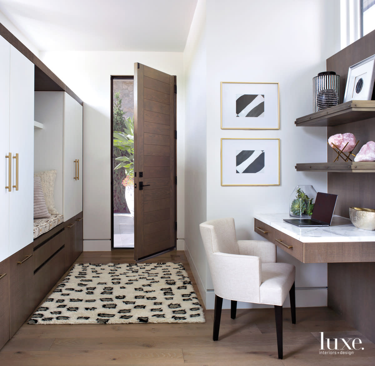 floating desk and entry storage with white oak and bronze pulls