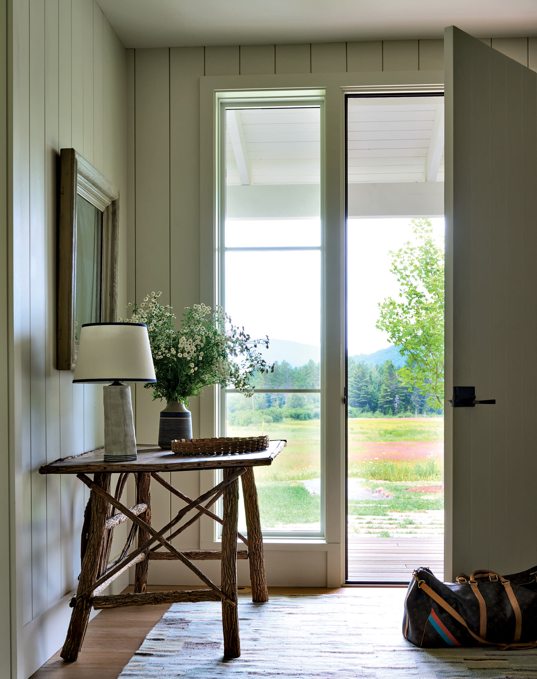 traditional entryway with a rustic wood table