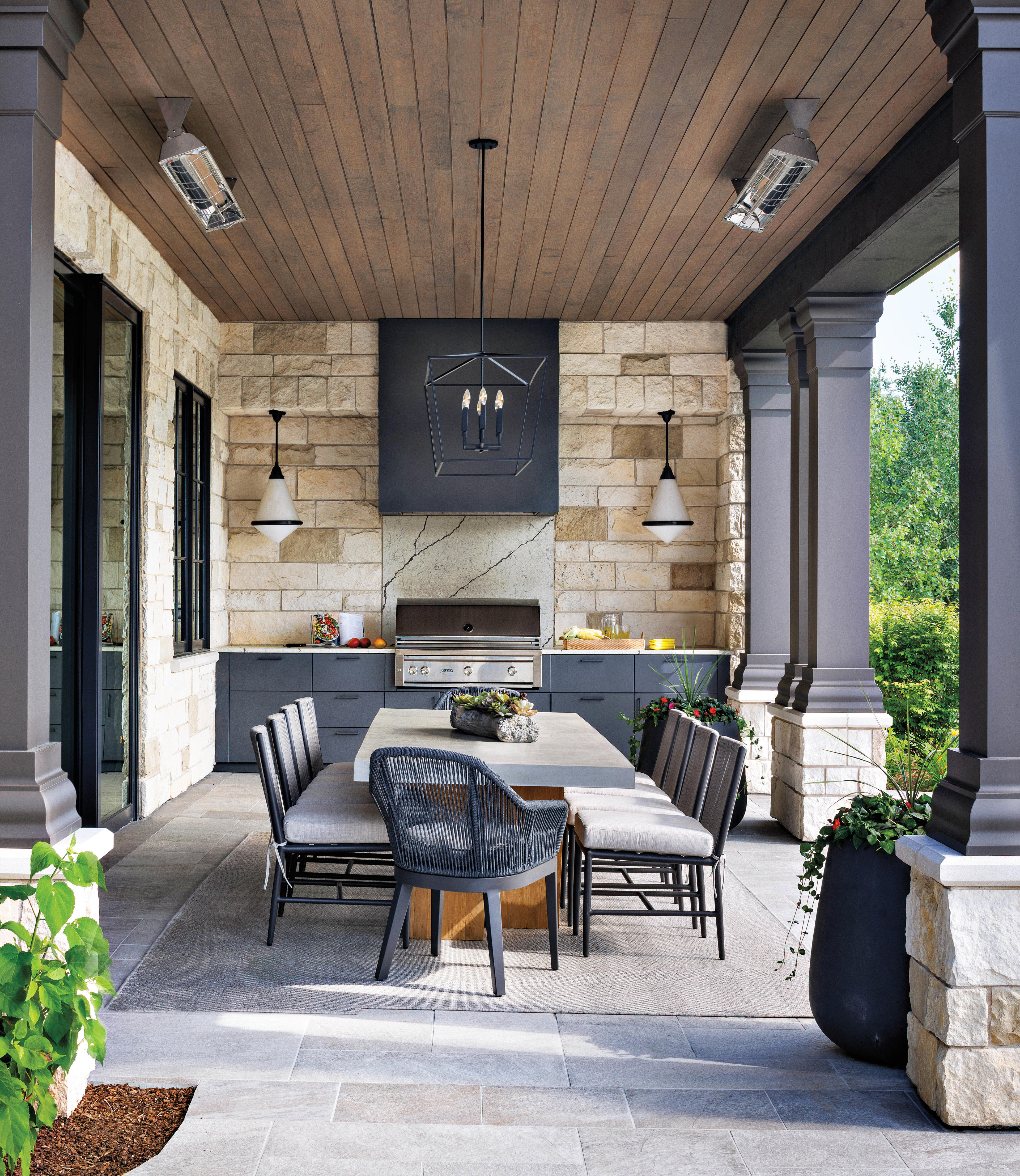 a stone patio lines the exterior of this Colorado home