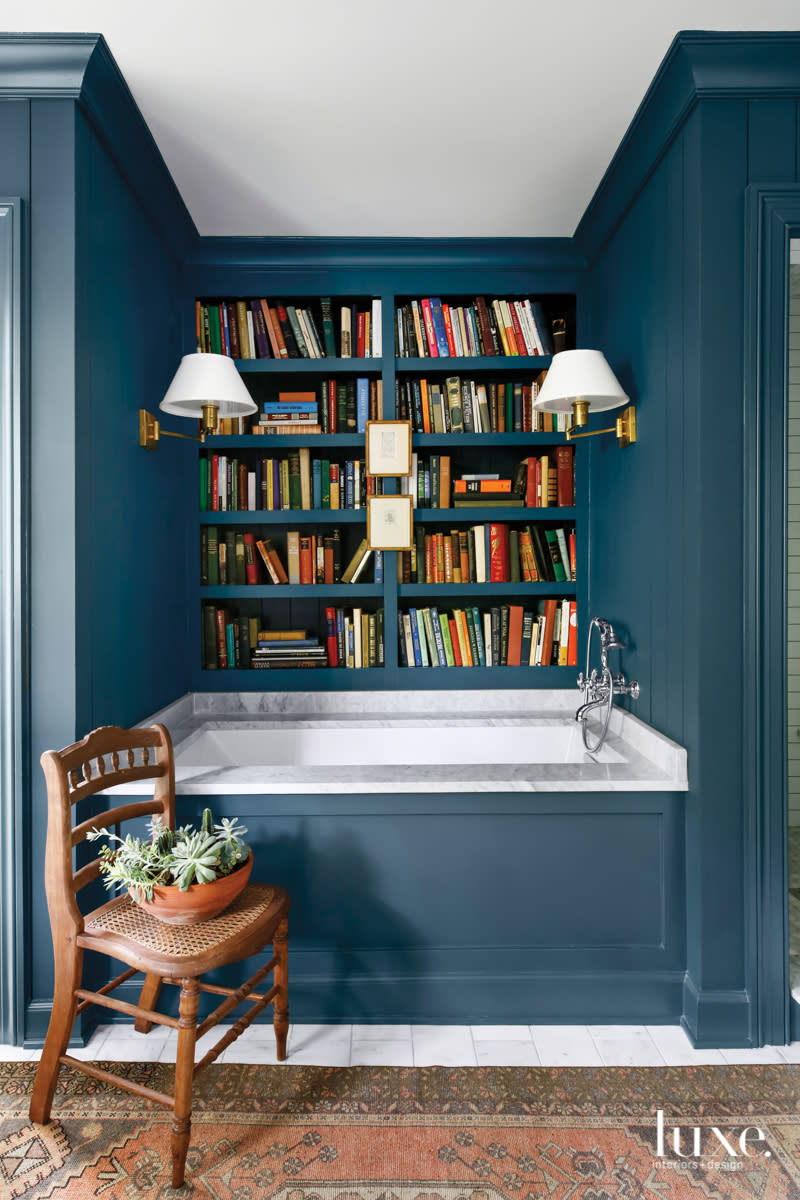 master bathroom soaking tub with bookcases