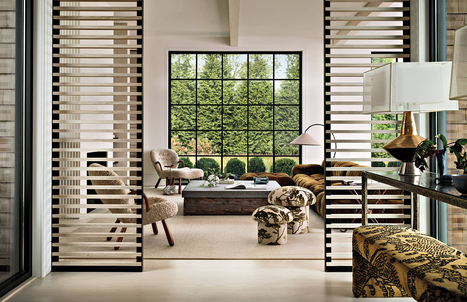white oak slats partition a classic foyer from a contemporary den