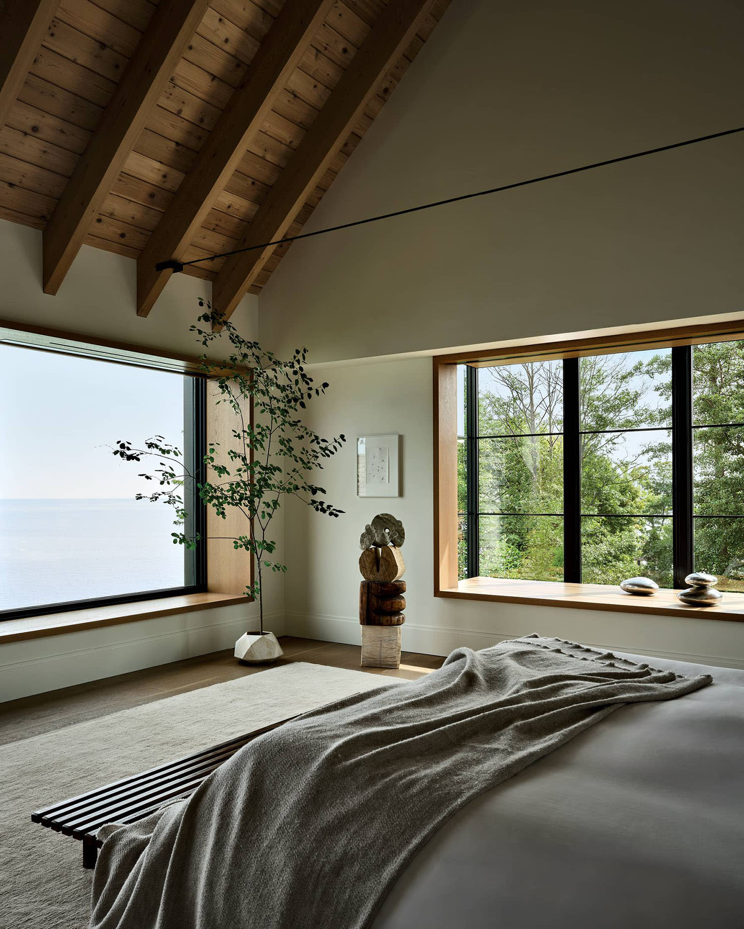 contemporary neutral bedroom with lake views 