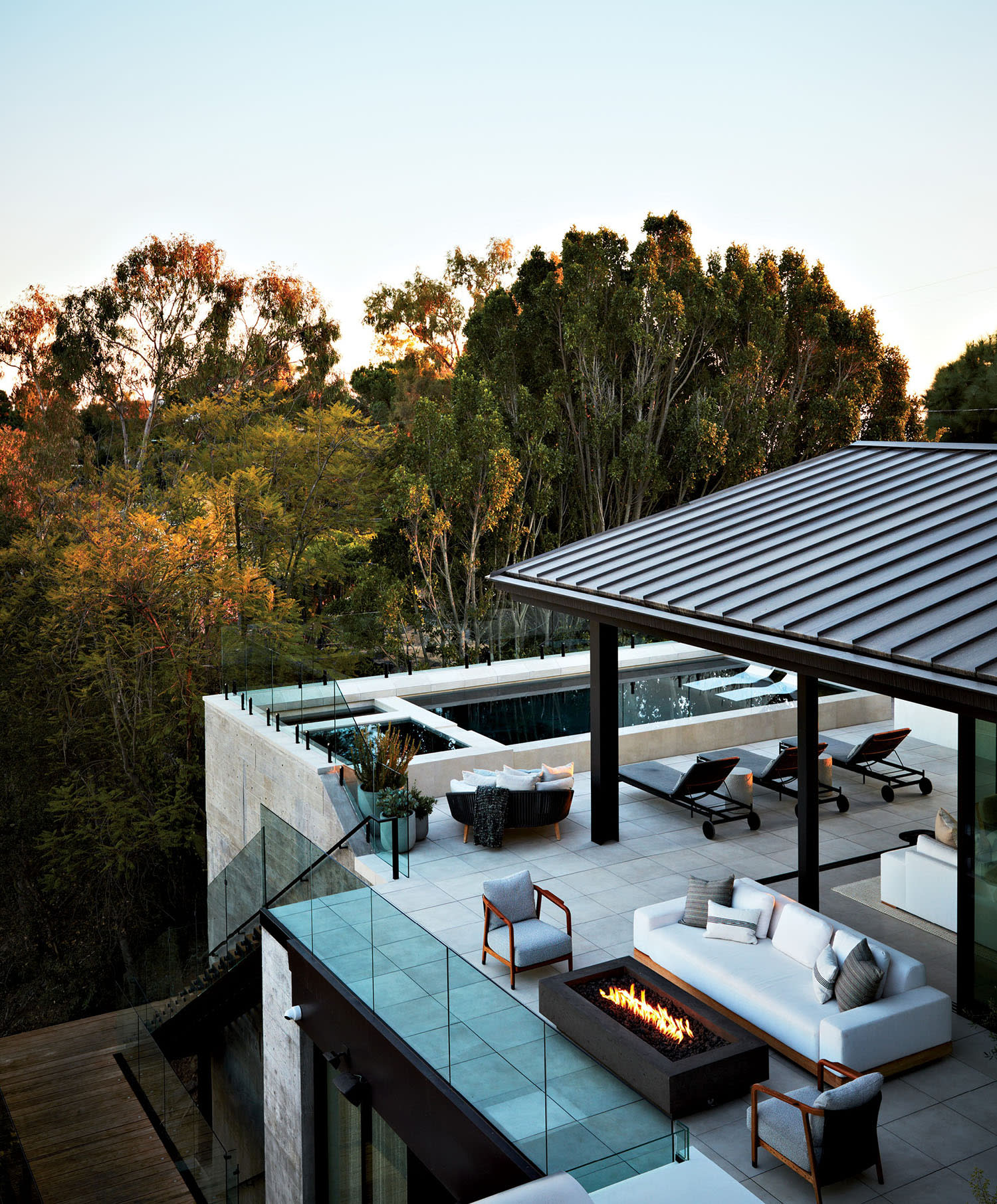 an aerial view of a mid-level pool deck on a contemporary Los Angeles home