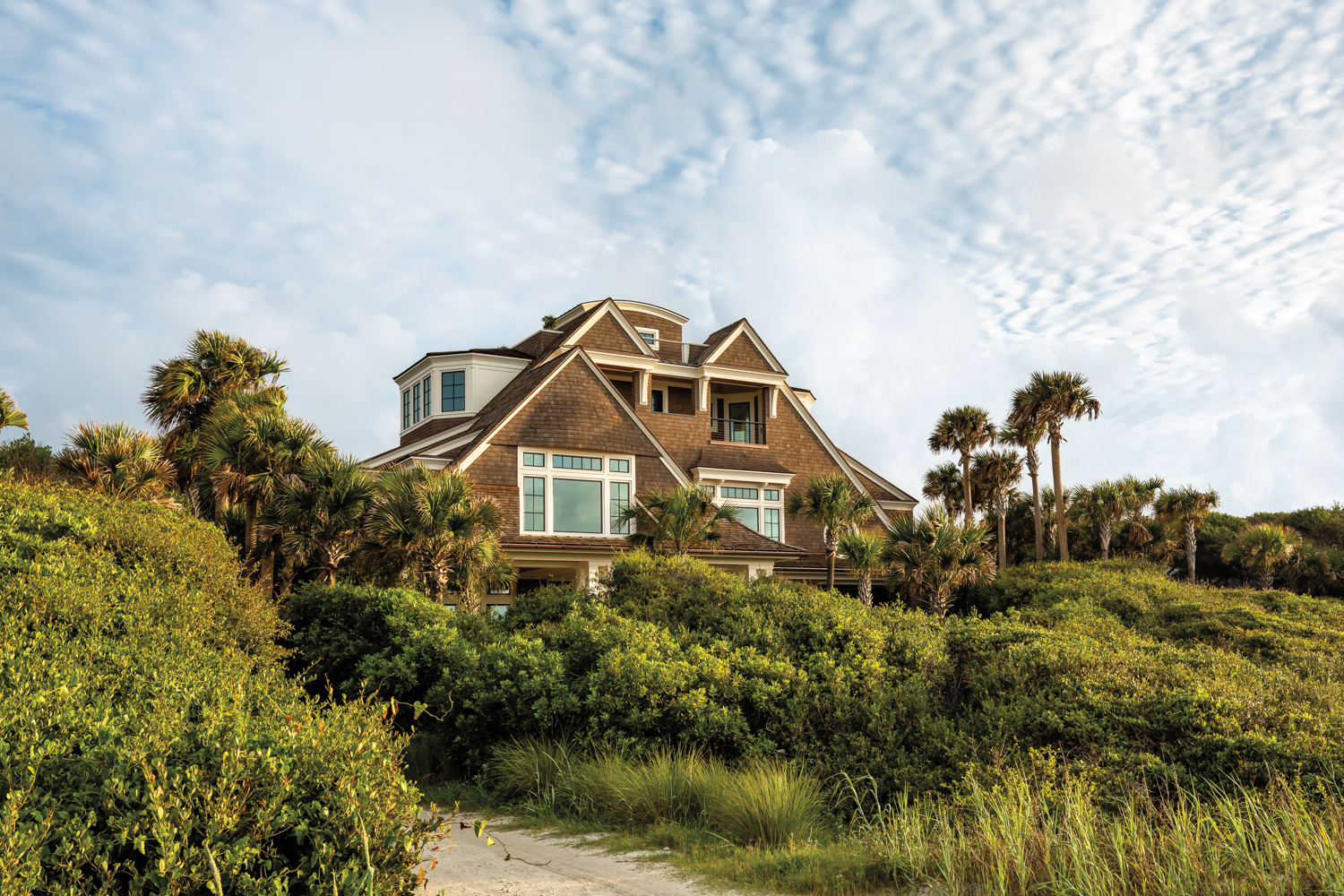 Traditional house nestled into a coastal landscape by designer Tammy Connor