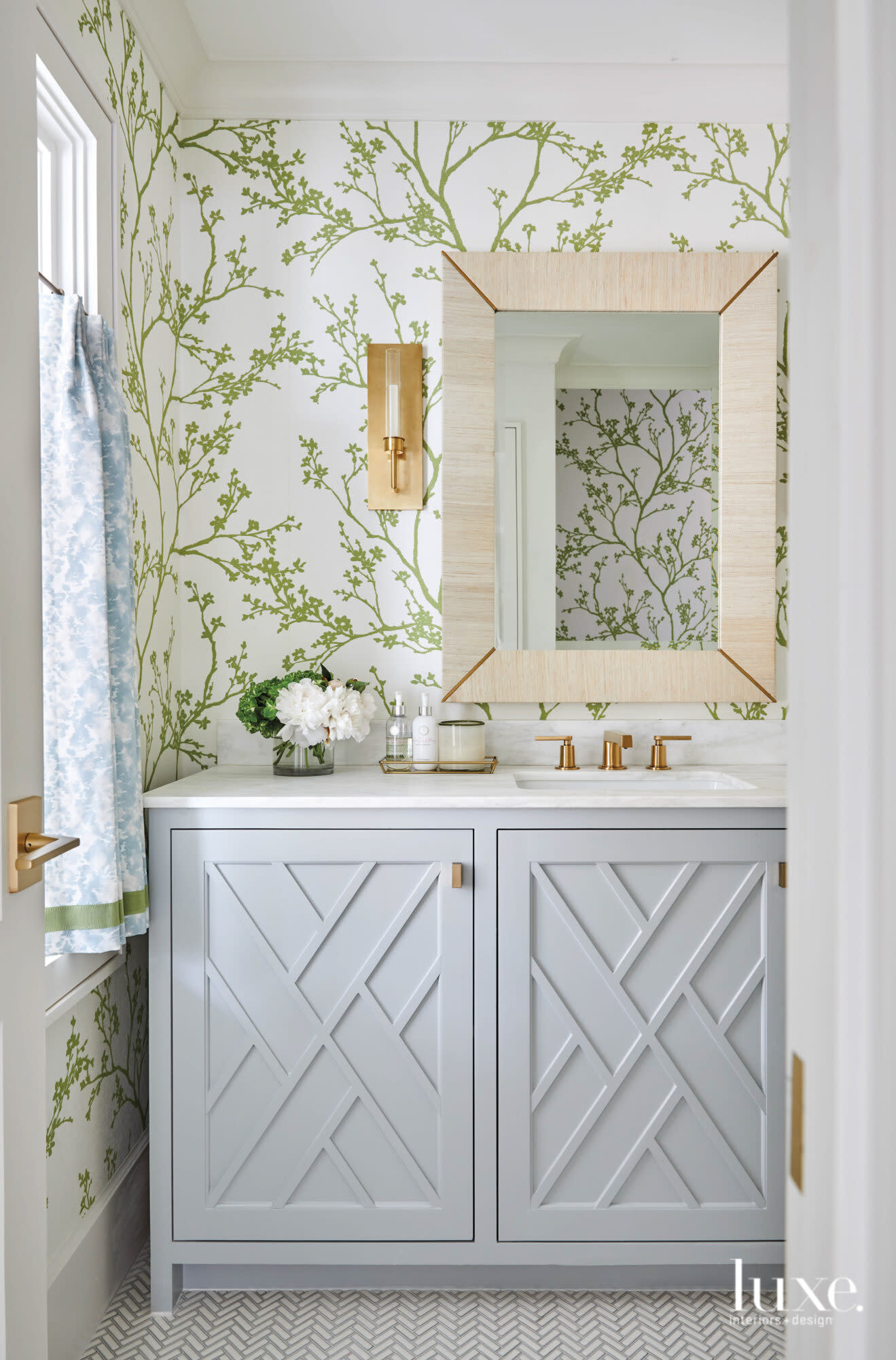 Powder bathroom with wallpaper