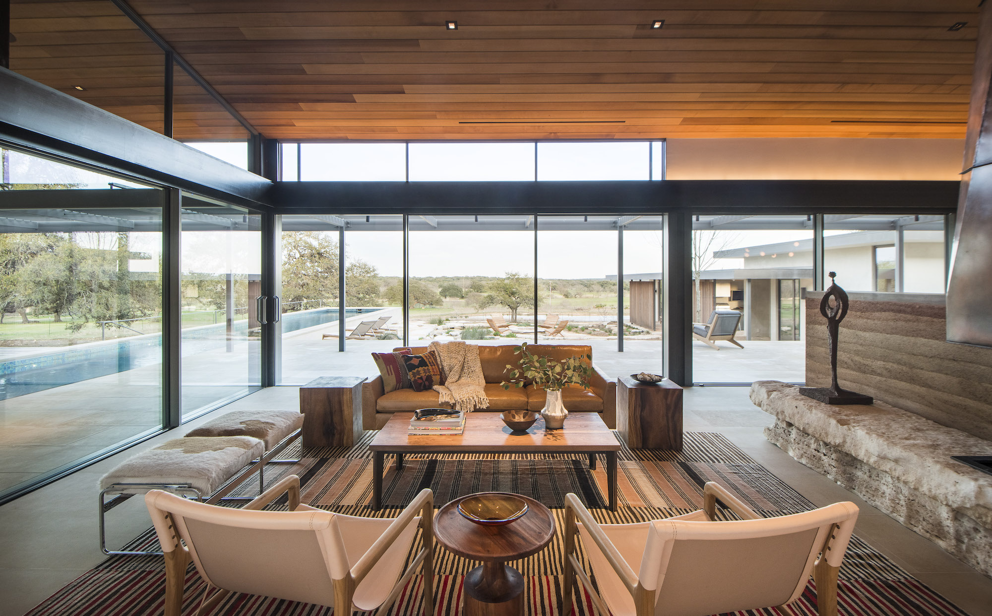 Living room with wall to floor windows.