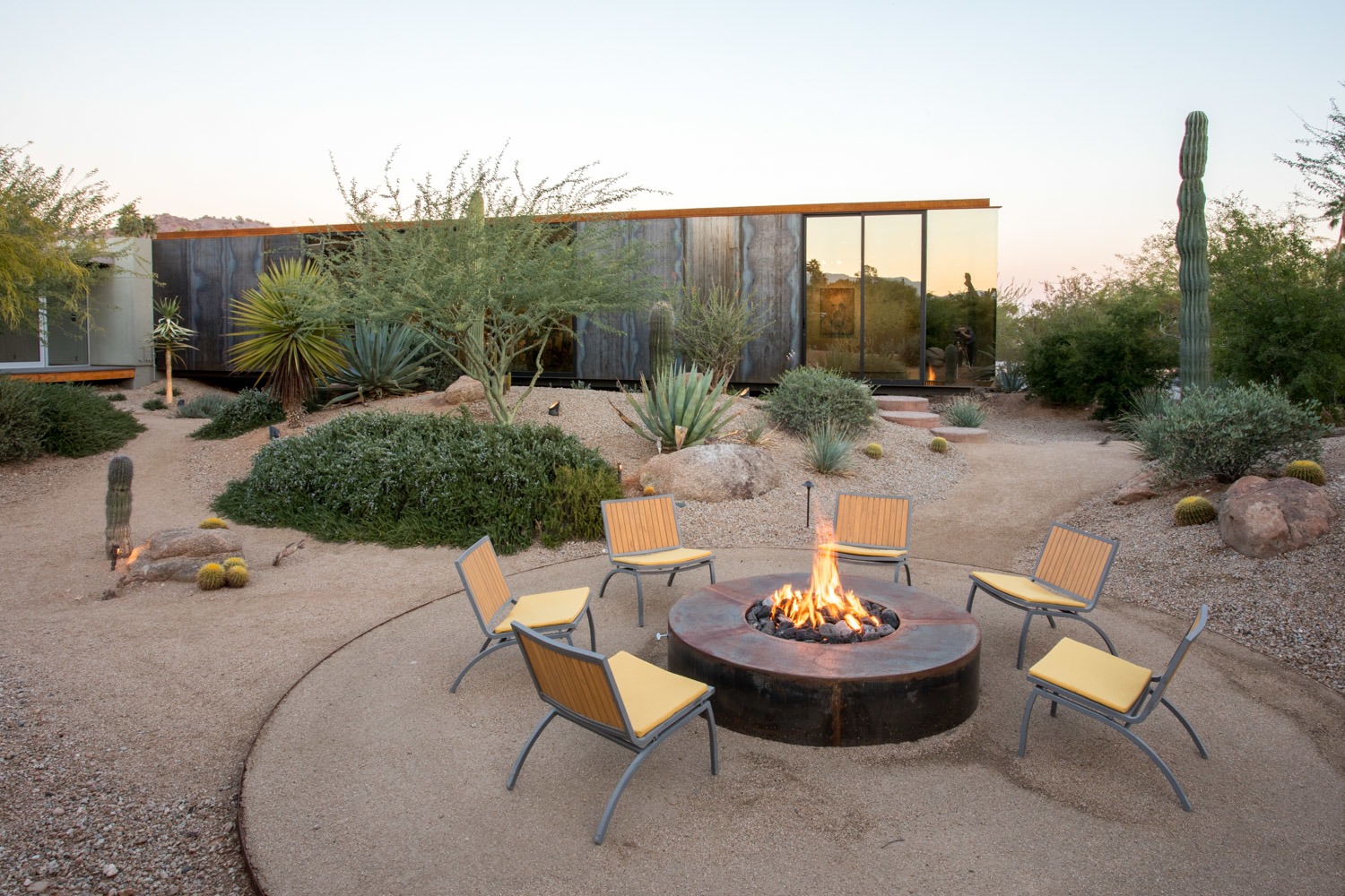 "The landscape was all in place there due to the existing courtyard," says Suchart. "We largely designed and situated the project overall to be a good neighbor by embracing what was there and minimally disturbing the natural desert and, in particular, the wash."