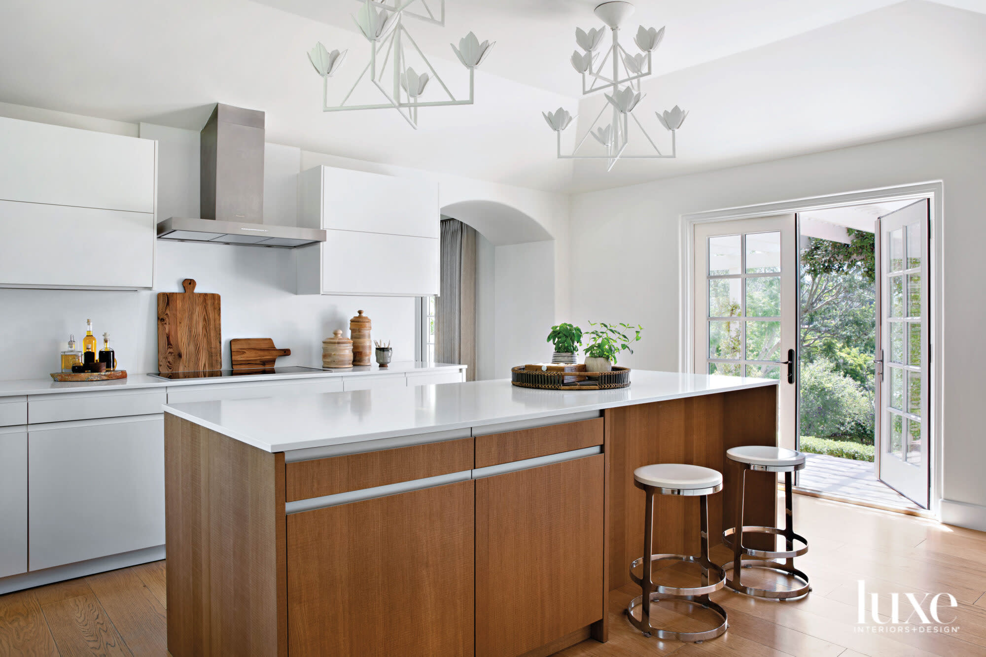 Kitchen with island and pair of barstools