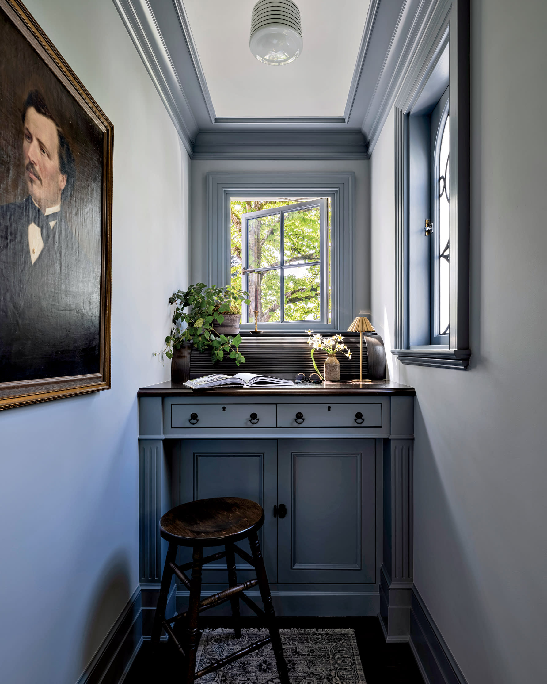 homey nook with vintage portrait on the wall