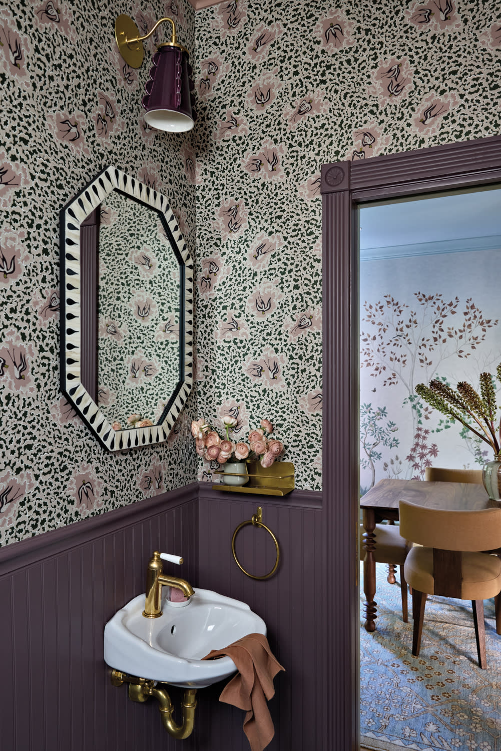 jewel box powder room with a bird-motif wallpaper and purple board and batten