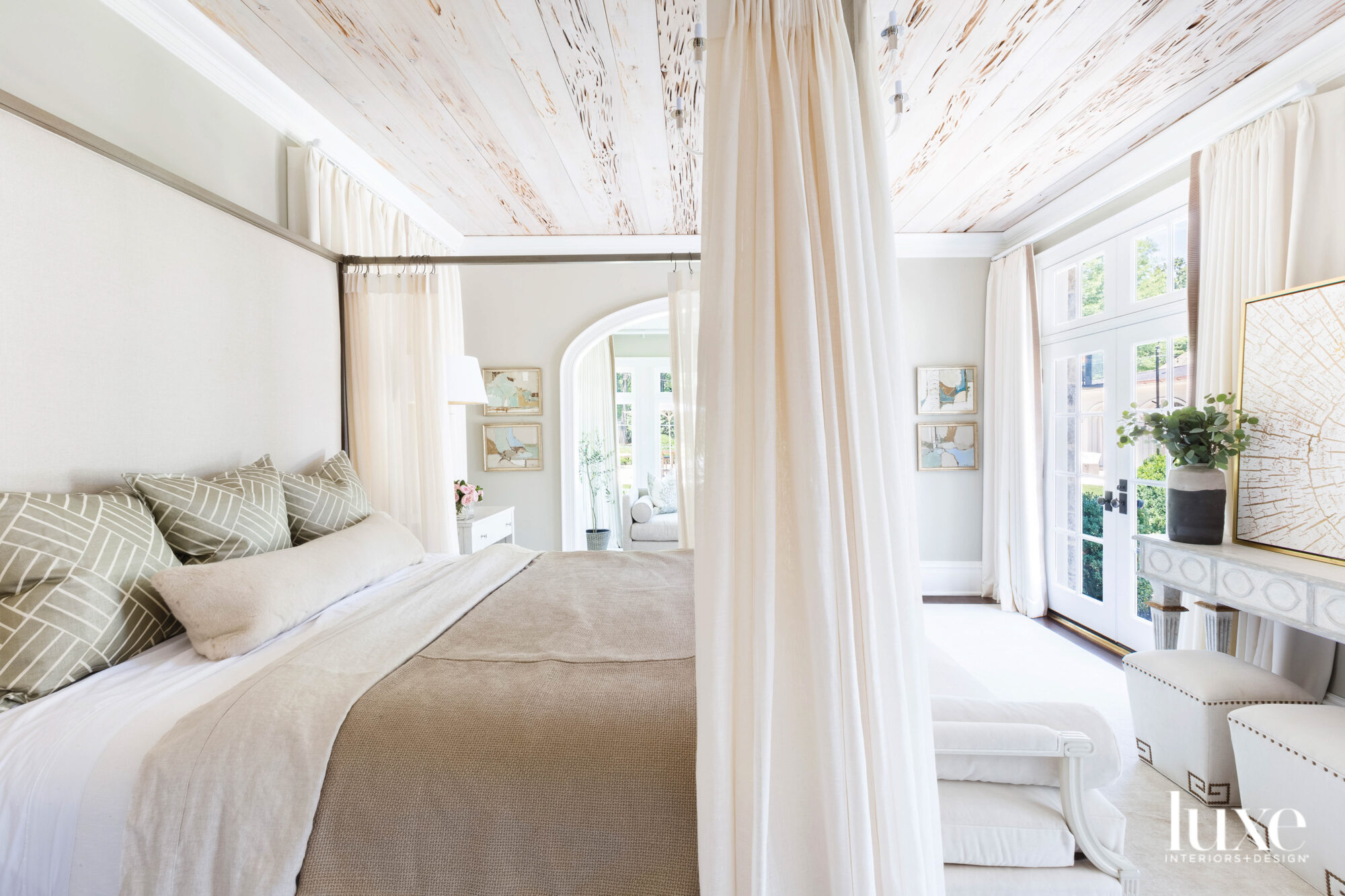 Canopy bed with panels and neutral coverlet in a zen bedroom