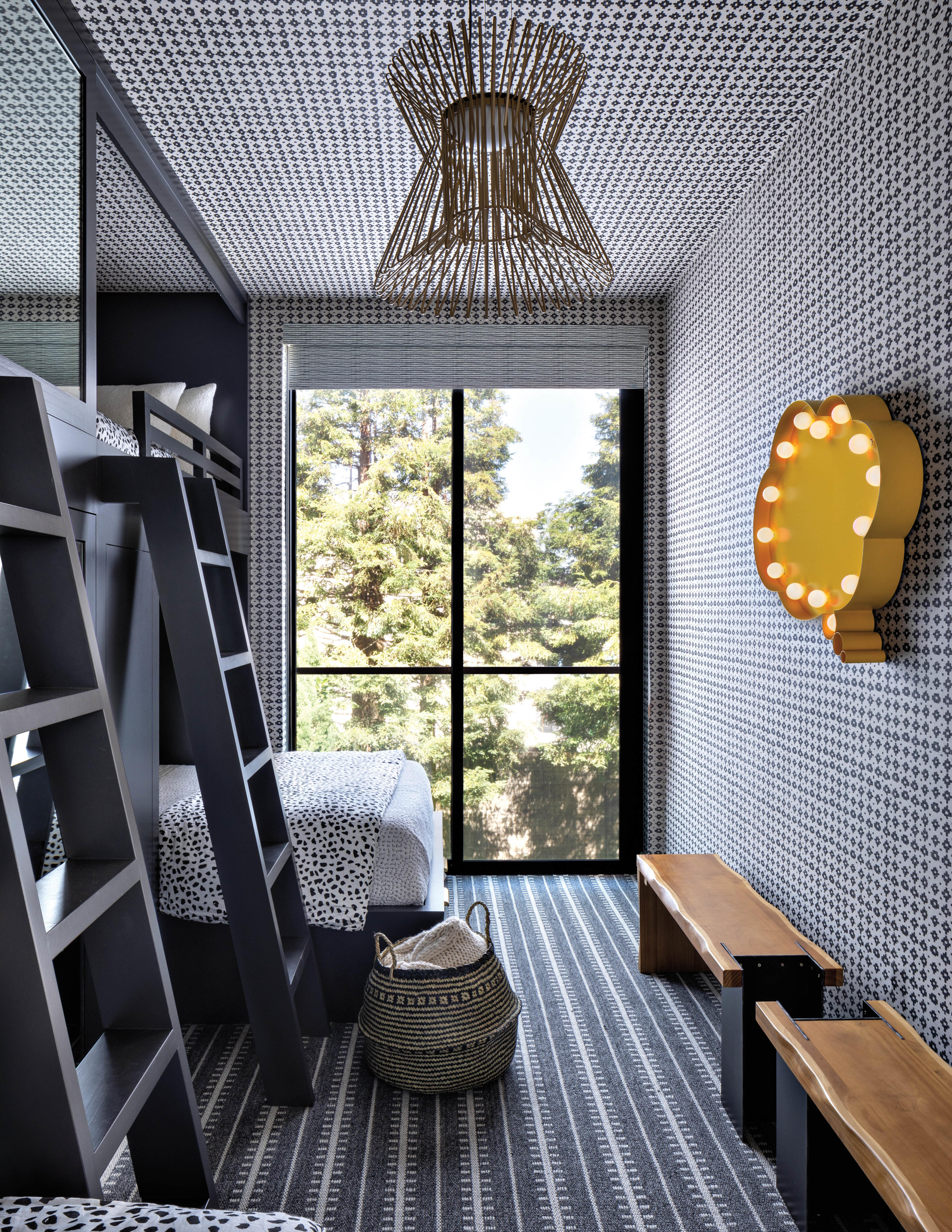 blue bunk room with striped carpet yellow pop-art and brass pendant 