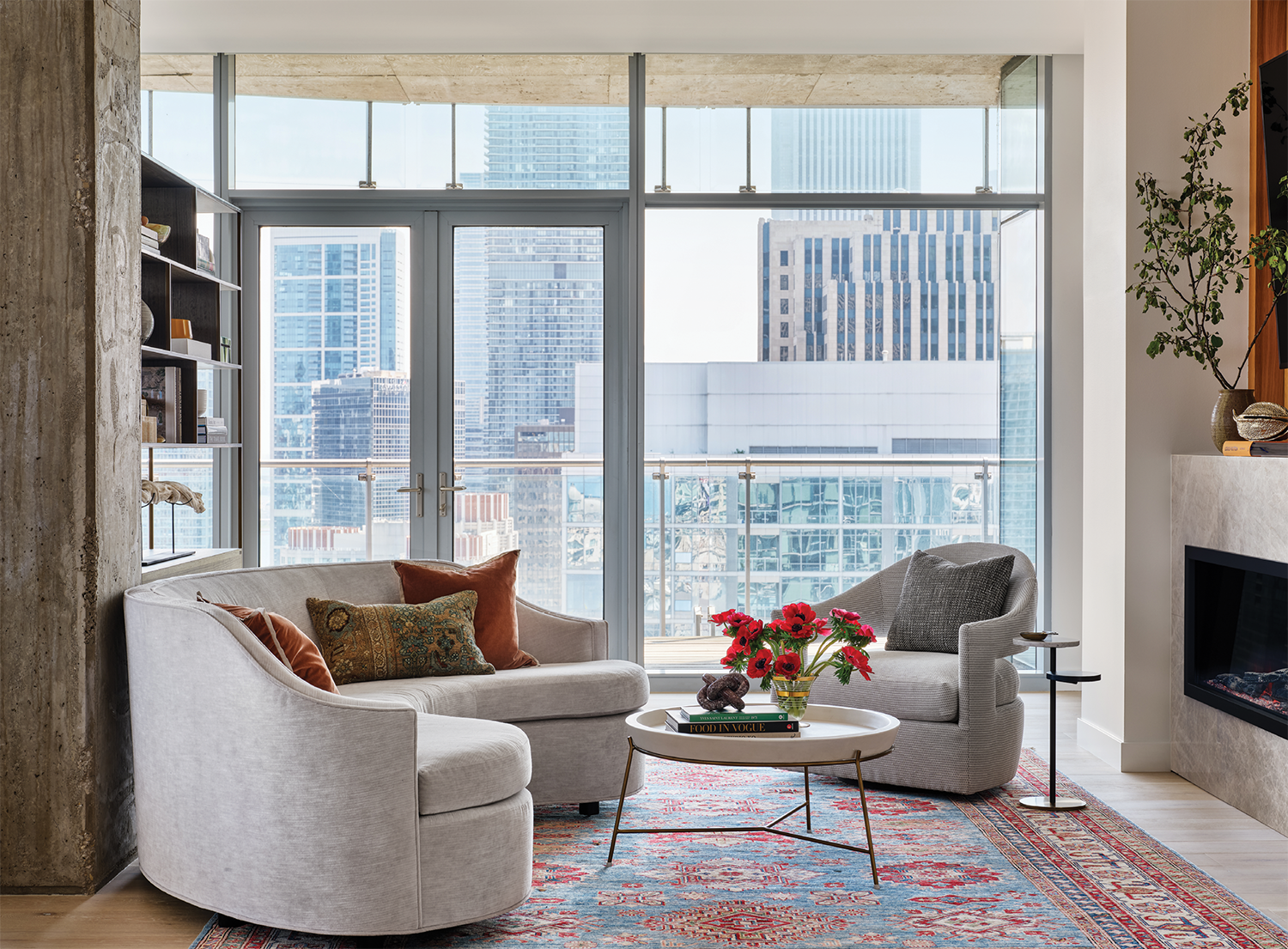 lounge space with open shelving and a cozy seating area