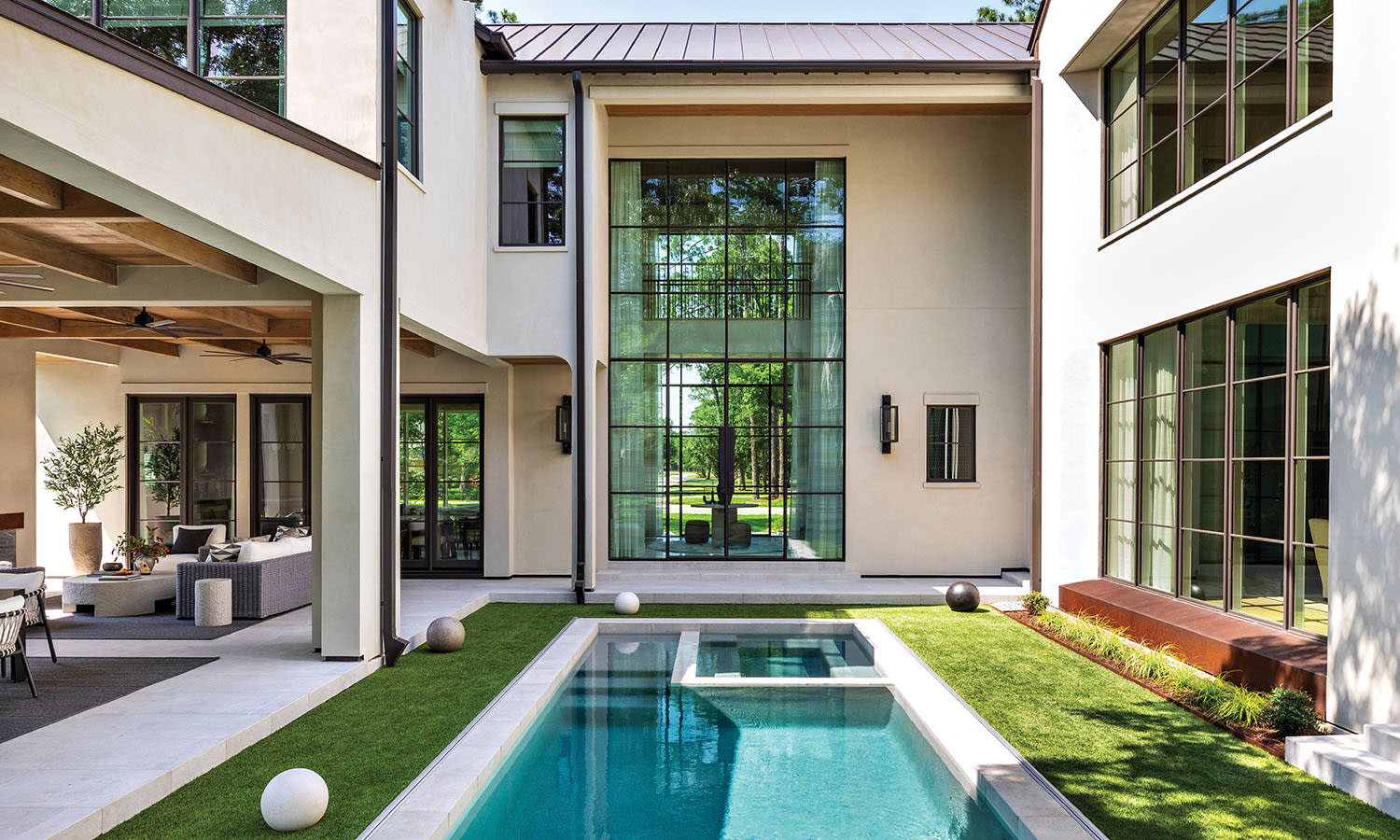 Houston home's courtyard with a pool