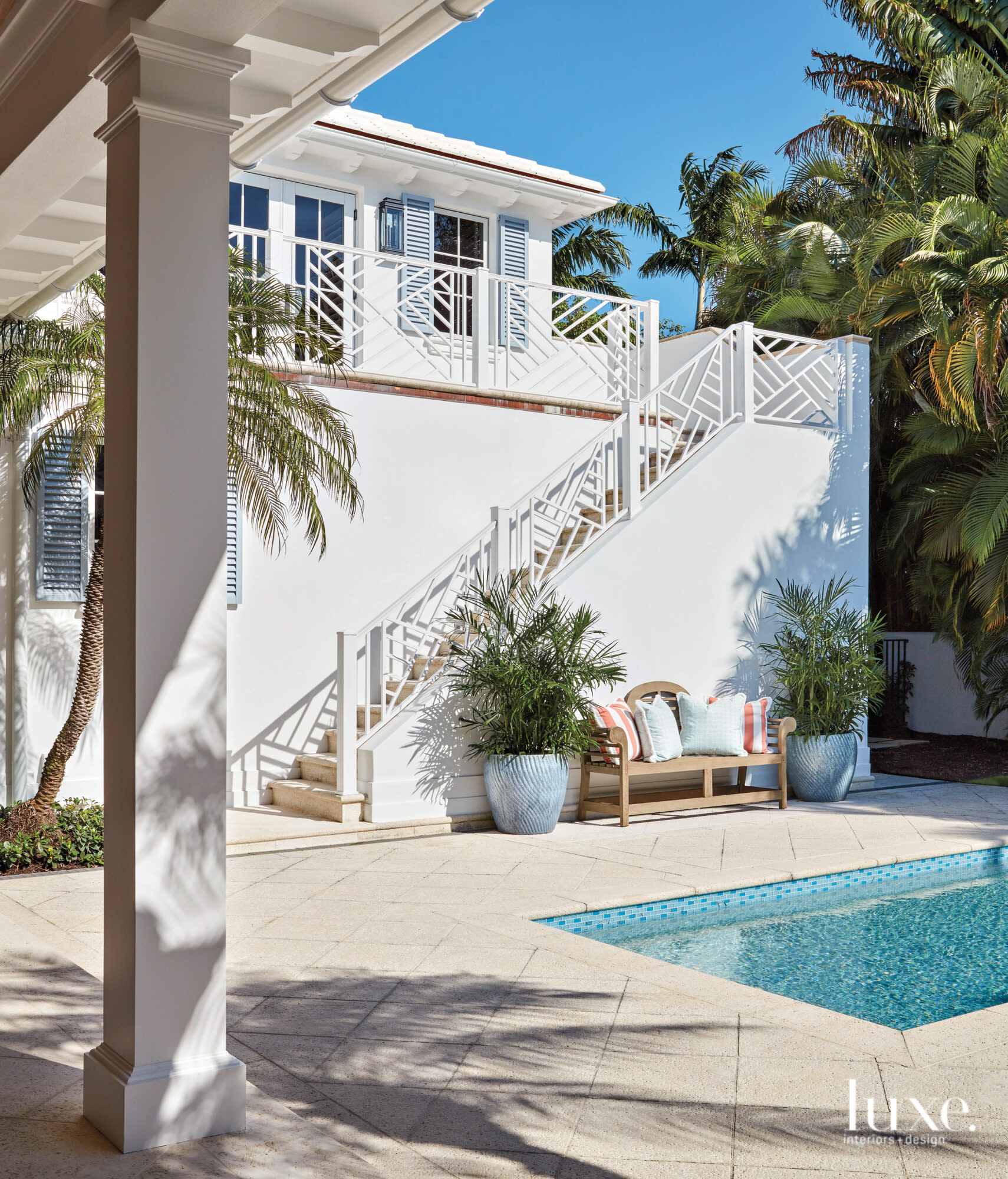 Exterior of guest quarters with stairs leading down to the pool.