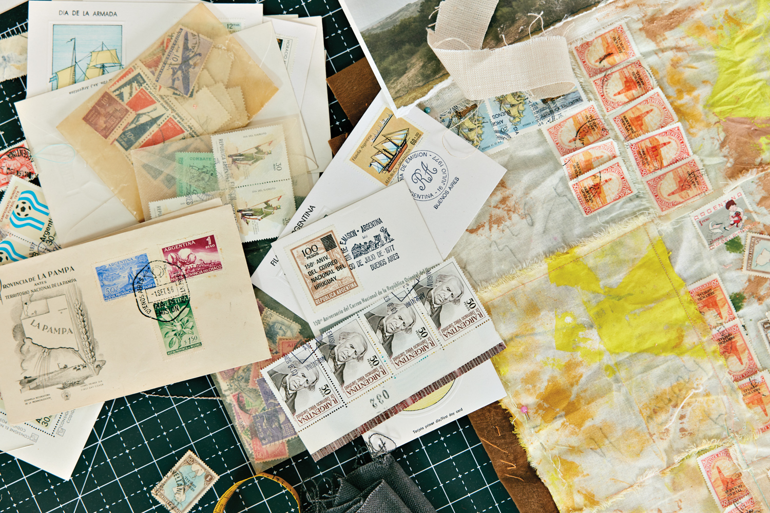 a collection of stamps in Veronica Pasman's studio for artistic inspiration