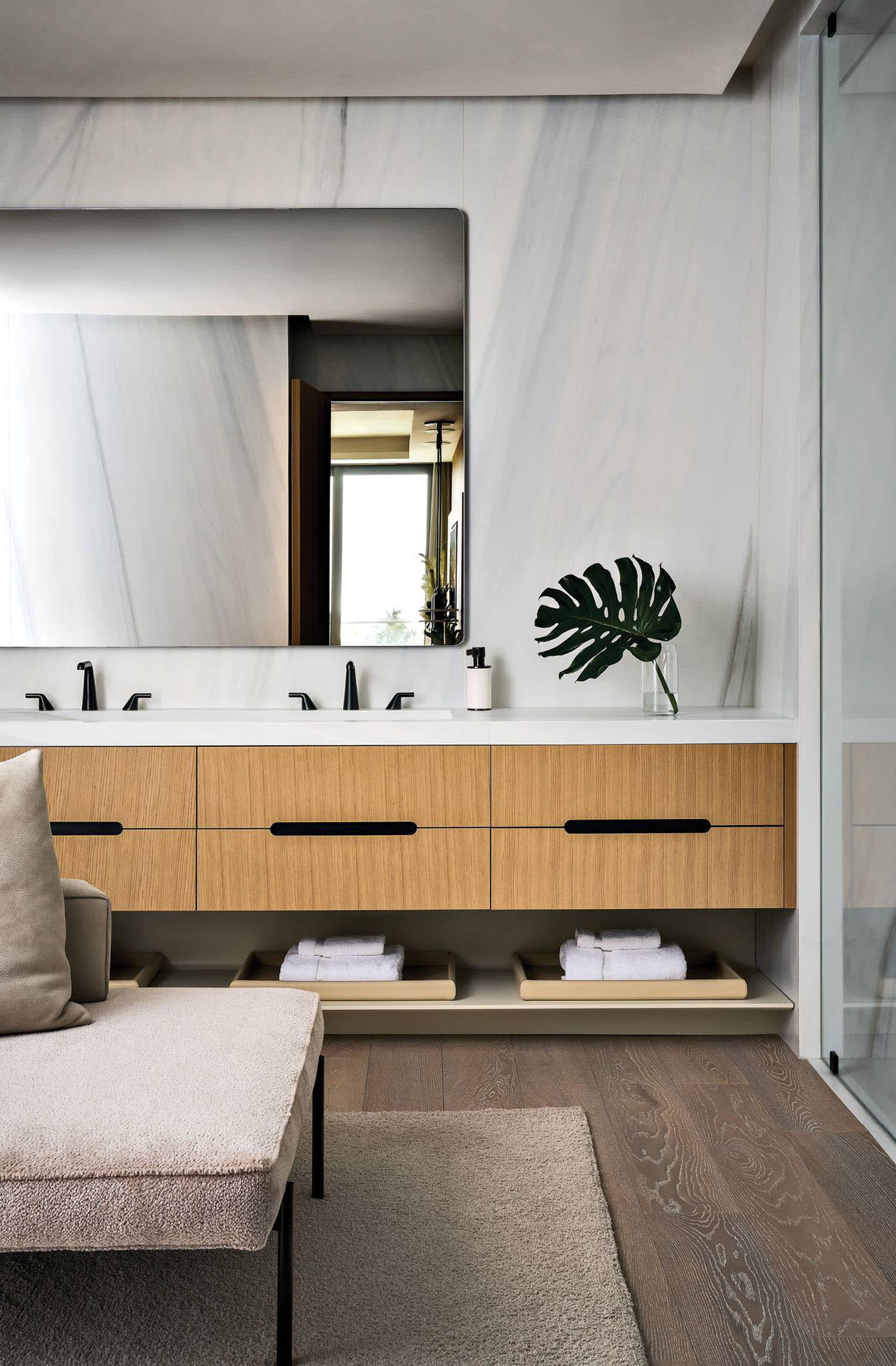 modern bathroom with porcelain walls and a wood-fronted vanity 