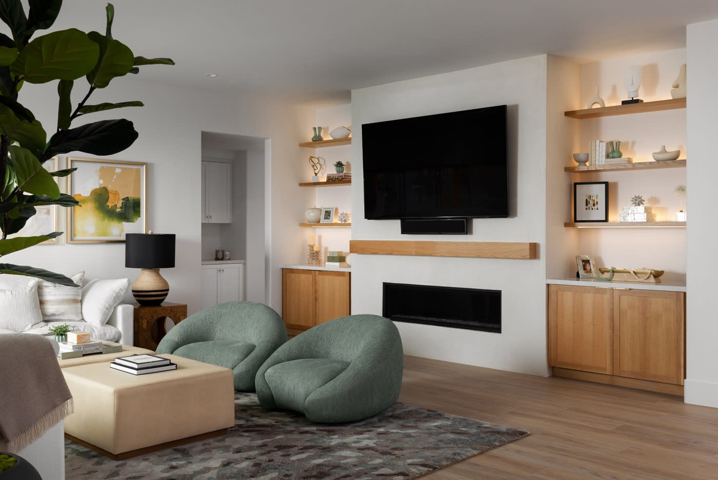 A cozy living room featuring a television and a fireplace, creating a warm and inviting atmosphere.