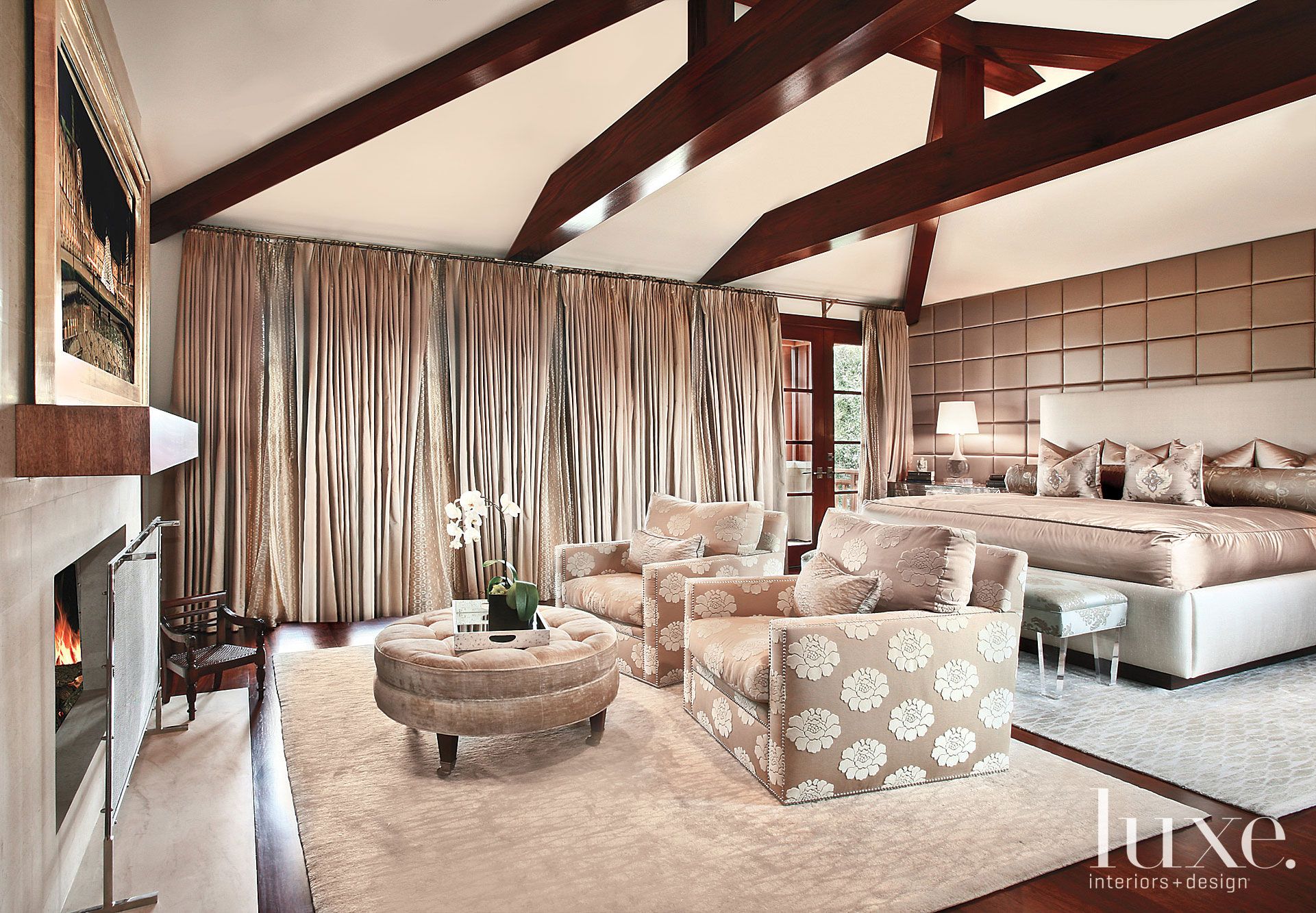 bright neutral room with spotted armchair and grey coffee table by Mark Scheurer