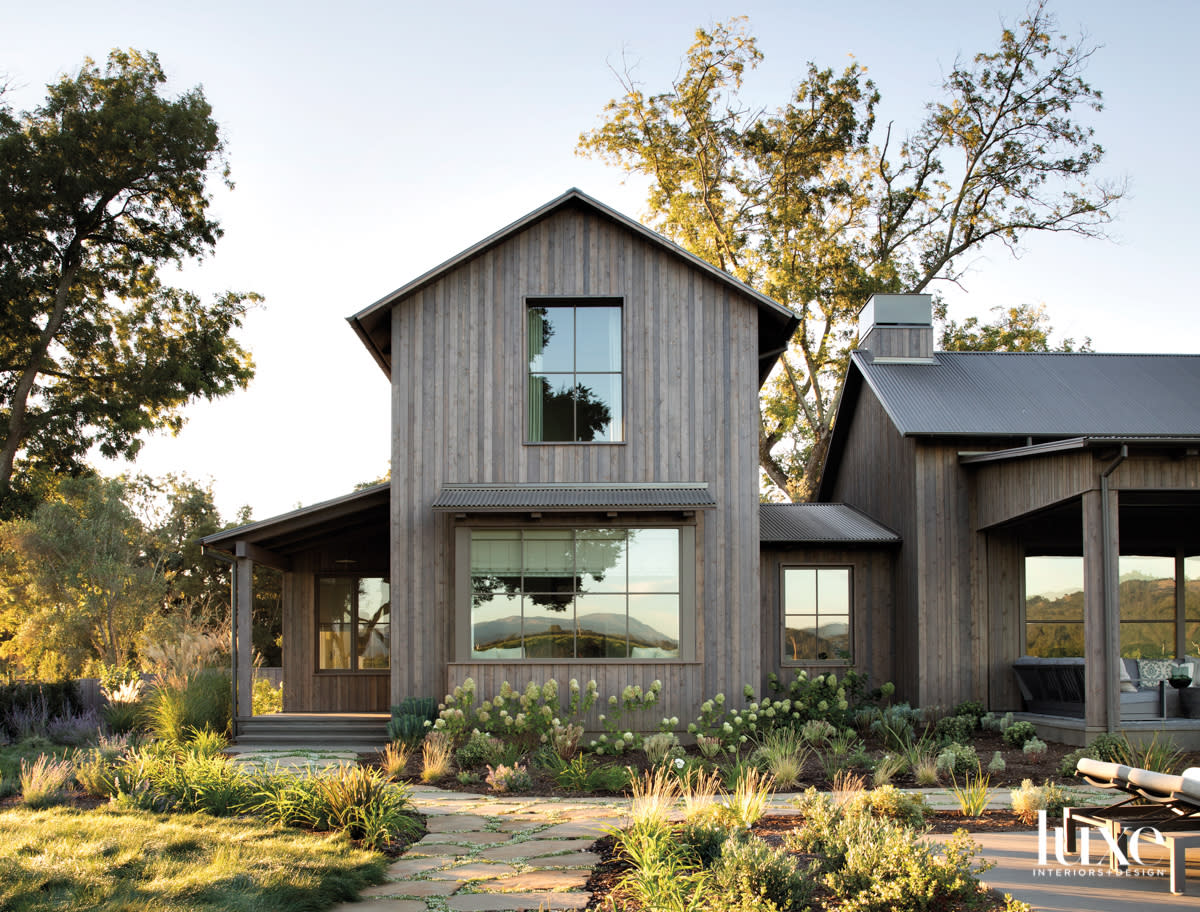 rustic exterior with hydrangeas and landscape