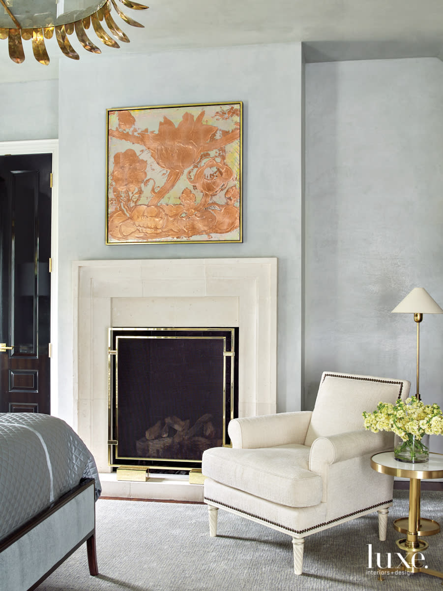 master suite with plastered walls, a winston wachter art piece and chair