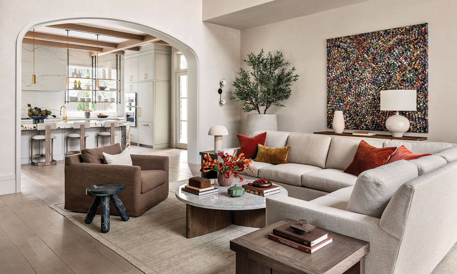 contemporary living room with an assortment of stone furnishings and a white sectional