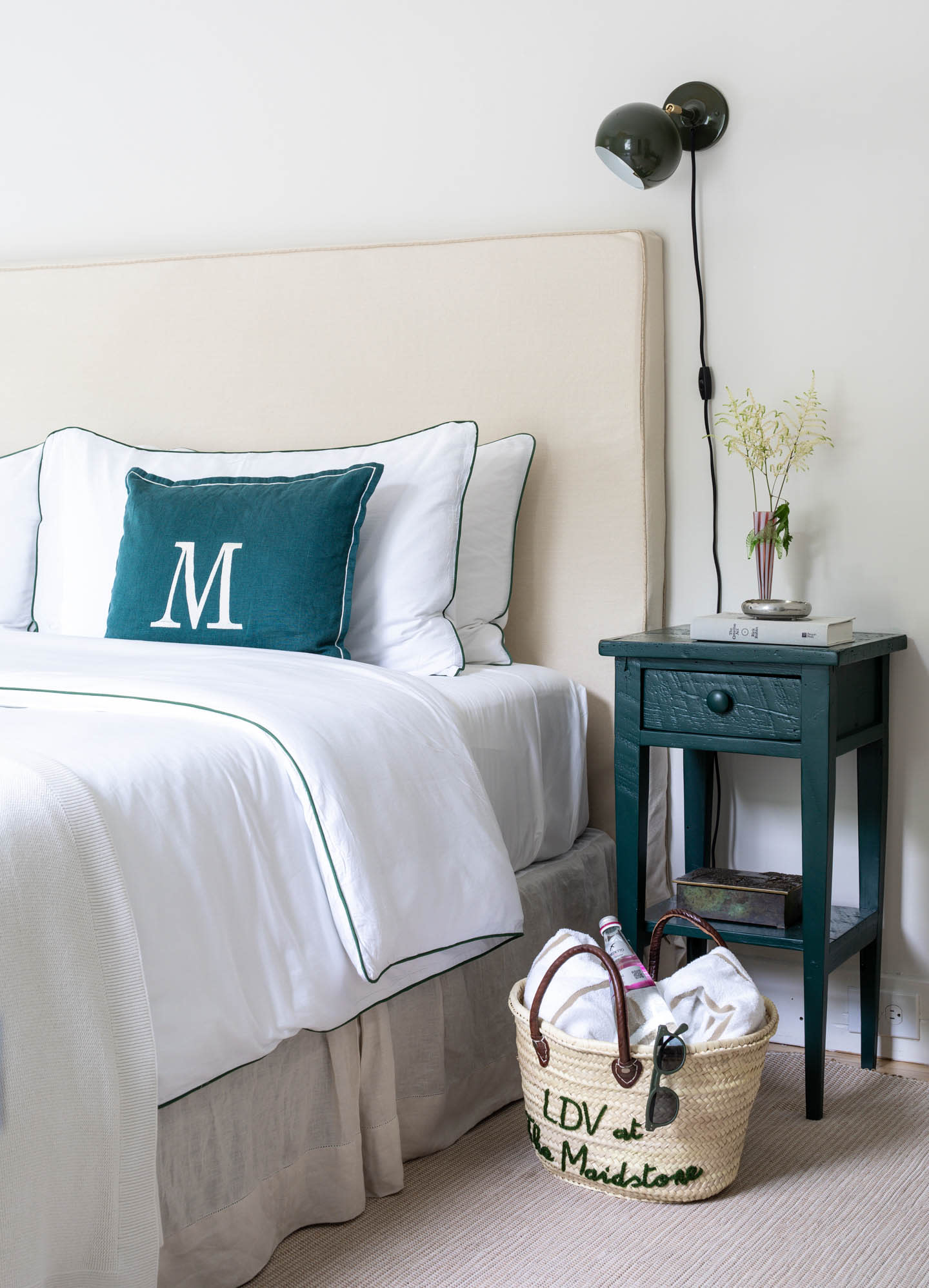 hotel bedroom with a dark blue nightstand 