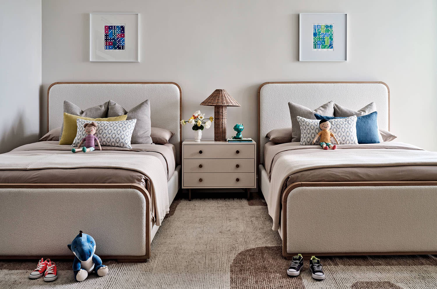 children's bedroom with matching beds and a neutral palette