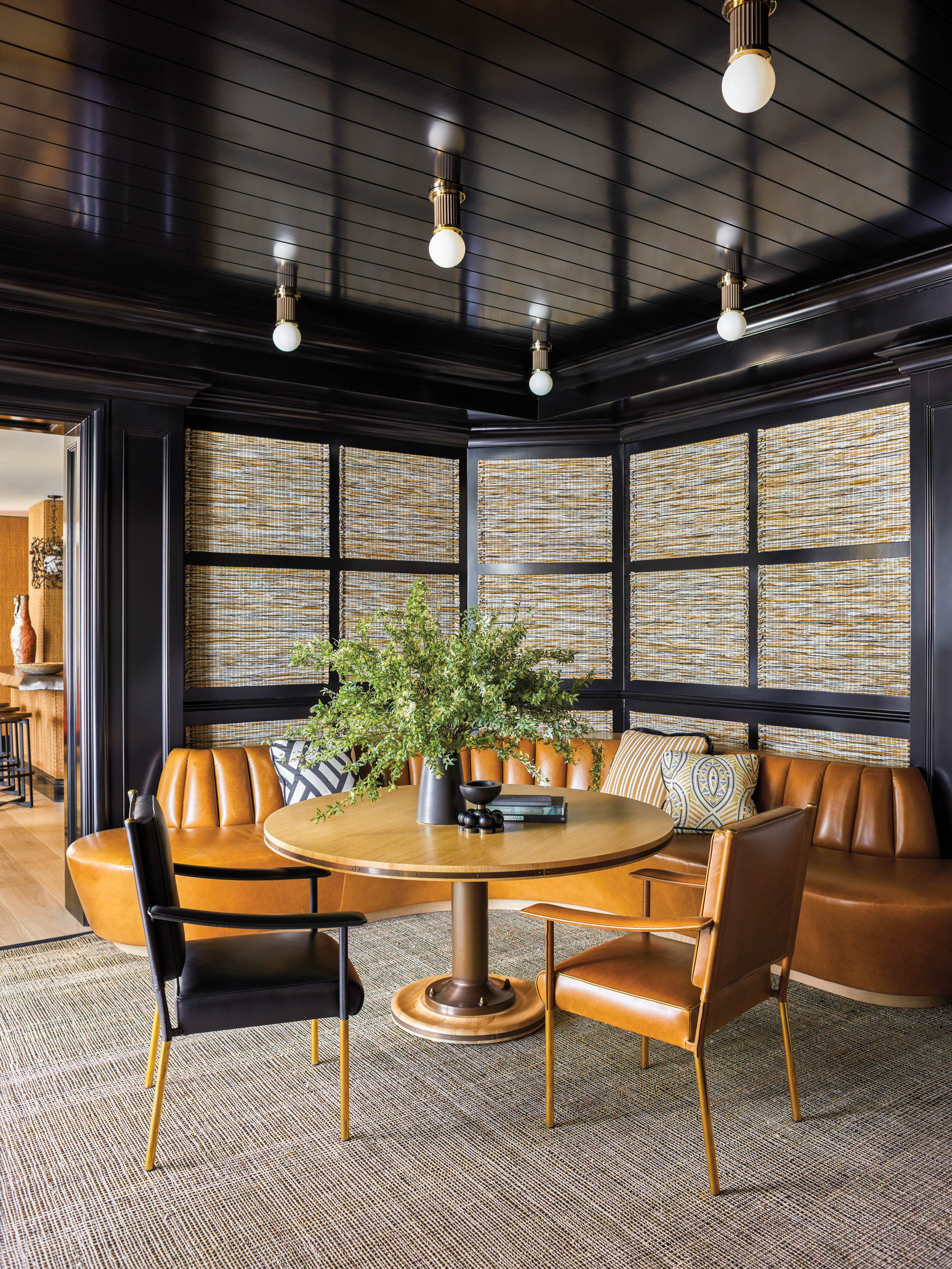 woven panels and black paint form the walls of a contemporary game room