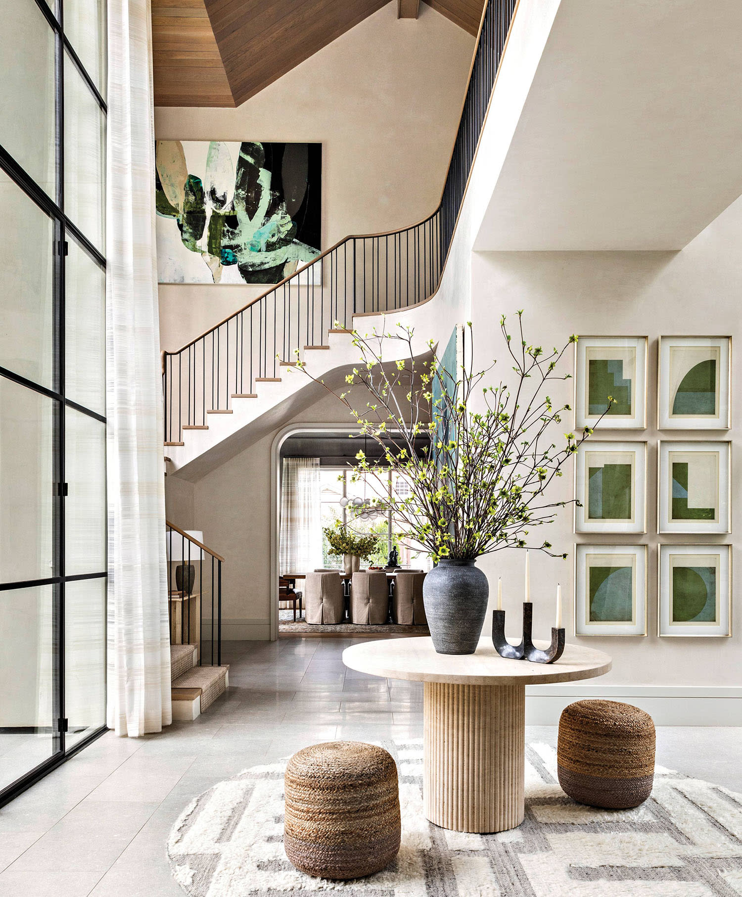 white dramatic entryway with double-height ceilings 