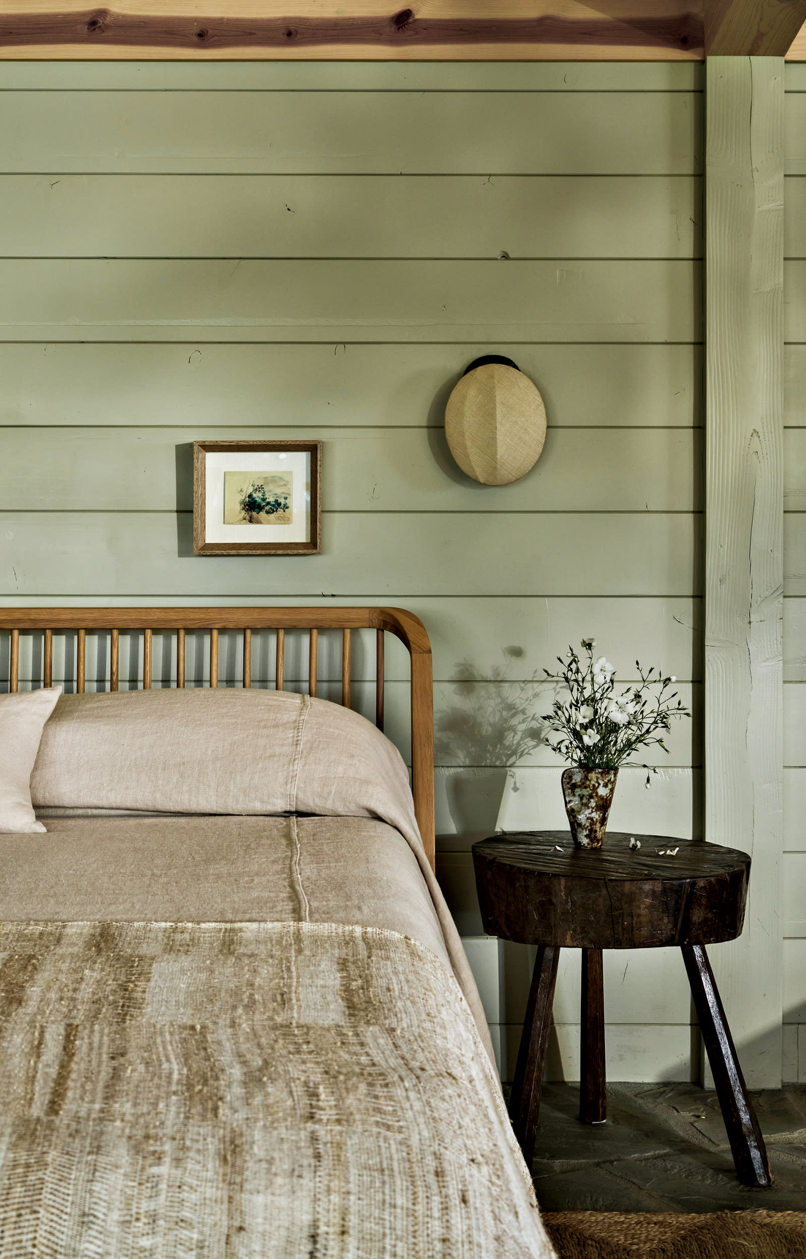 farmhouse-inspired bedroom with sage green walls