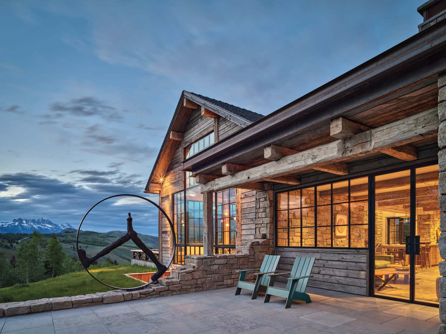 A grand residence with a significant circular window, emphasizing its architectural charm