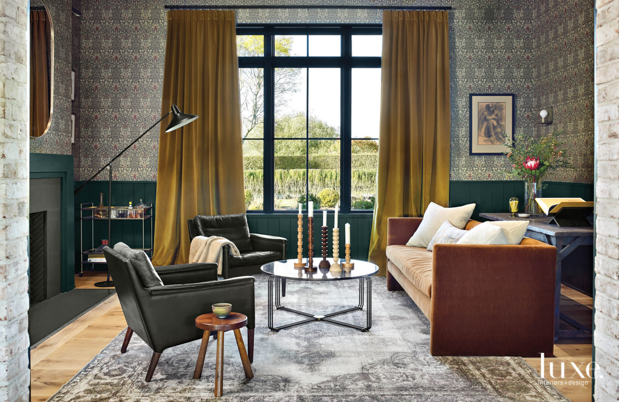 This dark den contrasts to the bright central living room