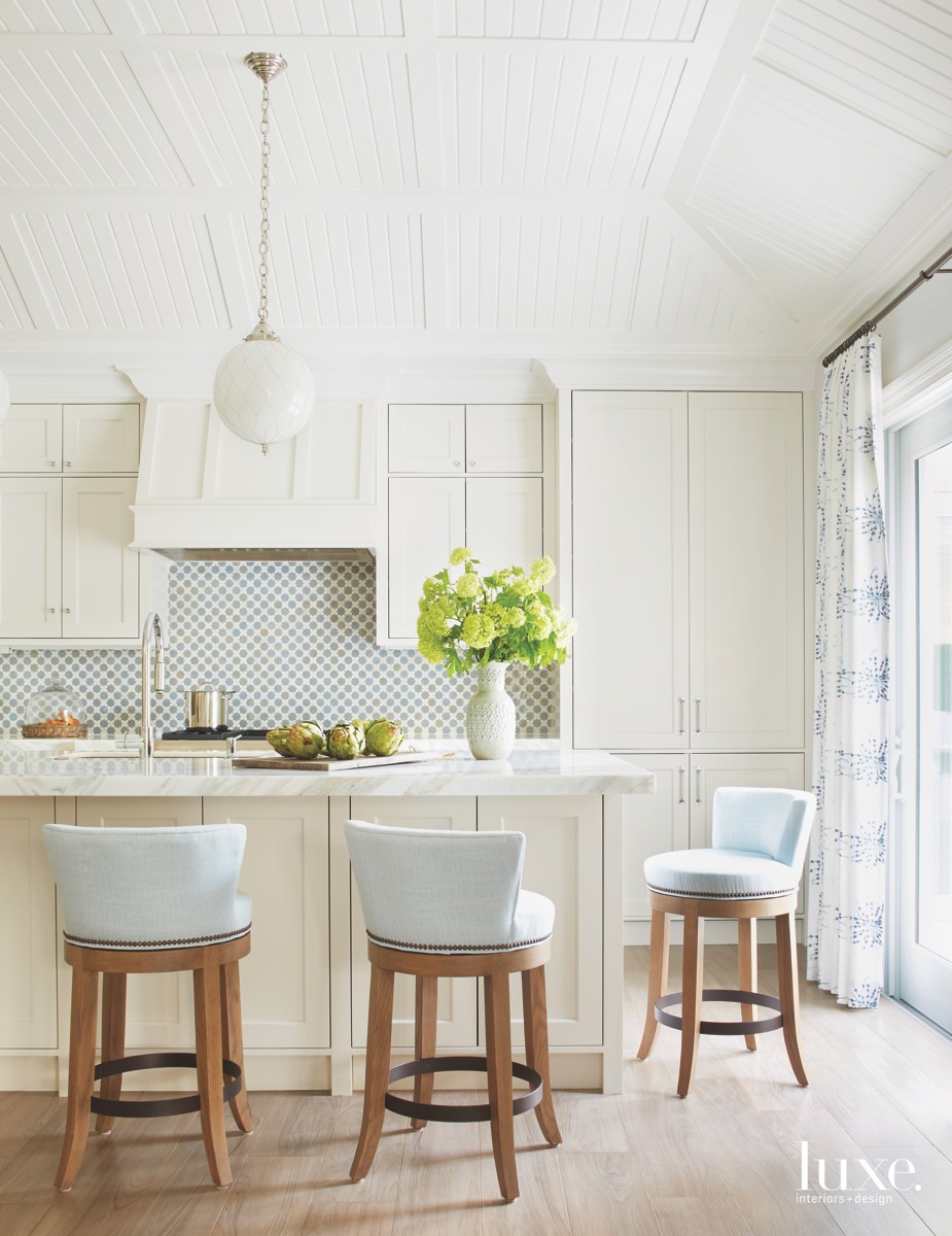 traditional white kitchen blue accents white walls